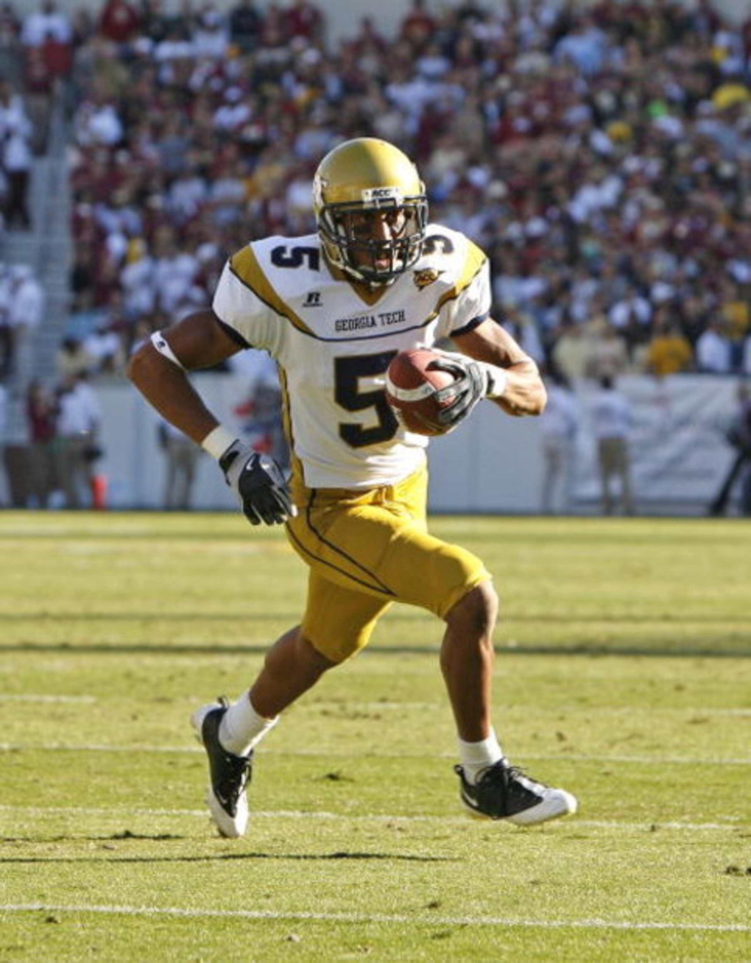 ATLANTA - NOVEMBER 1:  Running back Greg Smith #5 of the Georgia Tech Yellow Jackets rushes for a 3 yard touchdown during the game against the Florida State Seminoles at Bobby Dodd Stadium at Historic Grant Field on November 1, 2008 in Atlanta, Georgia.  