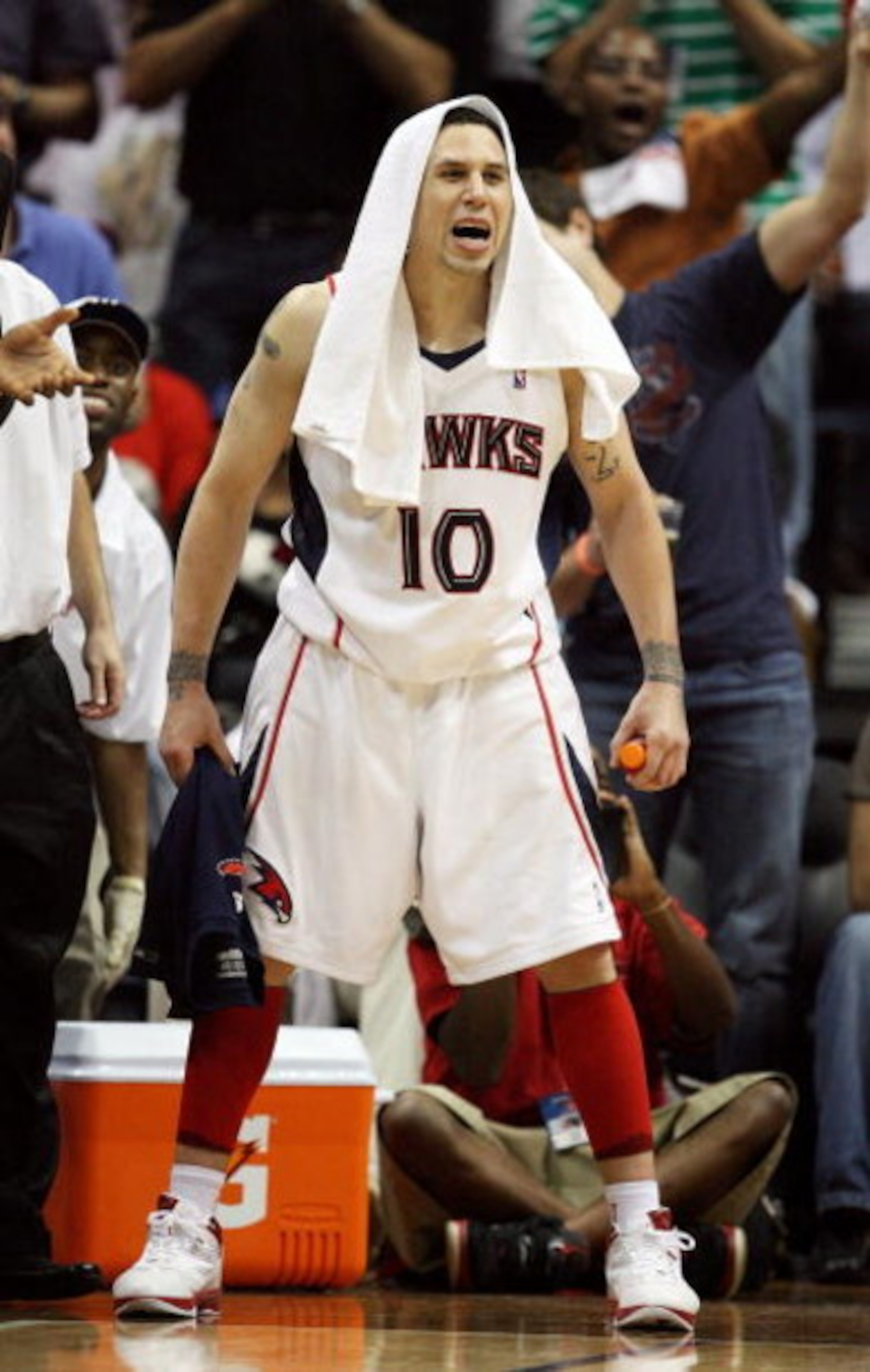 ATLANTA - MAY 03:  Mike Bibby #10 of the Atlanta Hawks celebrates from the bench late in the game against the Miami Heat during Game Seven of the Eastern Conference Quarterfinals at Philips Arena on May 3, 2009 in Atlanta, Georgia. The Hawks defeated the 