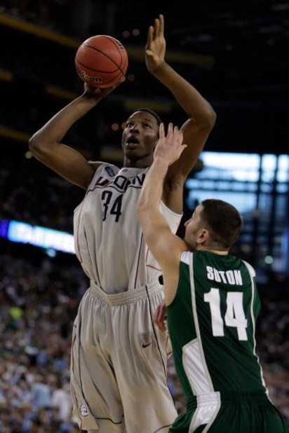 DETROIT - APRIL 04:  Hasheem Thabeet #34 of the Connecticut Huskies goes up for a shot over Goran Suton #14 of the Michigan State Spartans in the first half during the National Semifinal game of the NCAA Division I Men's Basketball Championship at Ford Fi