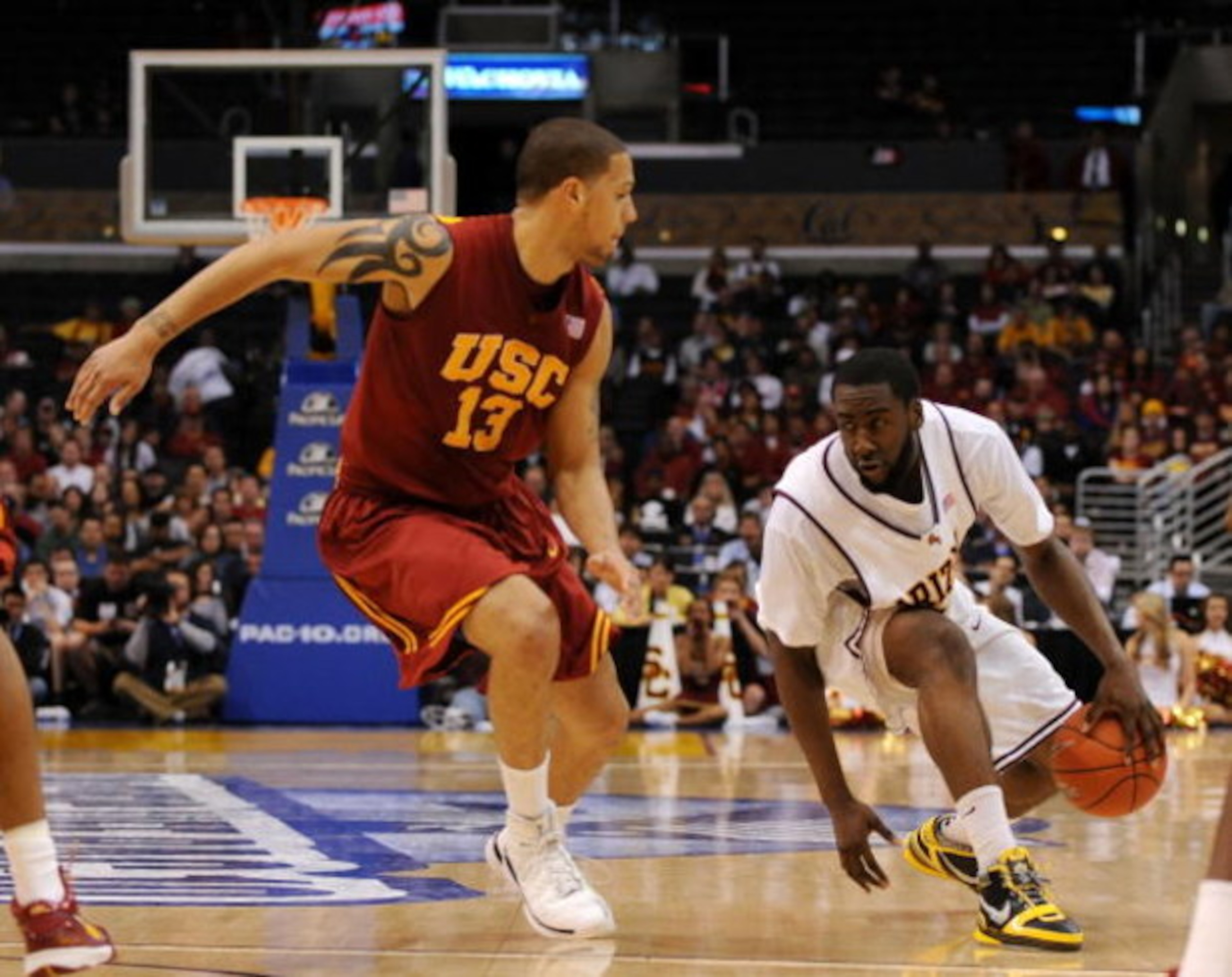 LOS ANGELES, CA - MARCH 14: Guard James Harden #13 of the Arizona State Sun Devils drives against guard Daniel Hackett #13 of the USC Trojans in the Pacific Life Pac-10 Men's Basketball Tournament Championship Game at the Staples Center on March 14, 2009 LOS ANGELES, CA - MARCH 14: Guard James Harden #13 of the Arizona State Sun Devils drives against guard Daniel Hackett #13 of the USC Trojans in the Pacific Life Pac-10 Men's Basketball Tournament Championship Game at the Staples Center on March 14, 2009