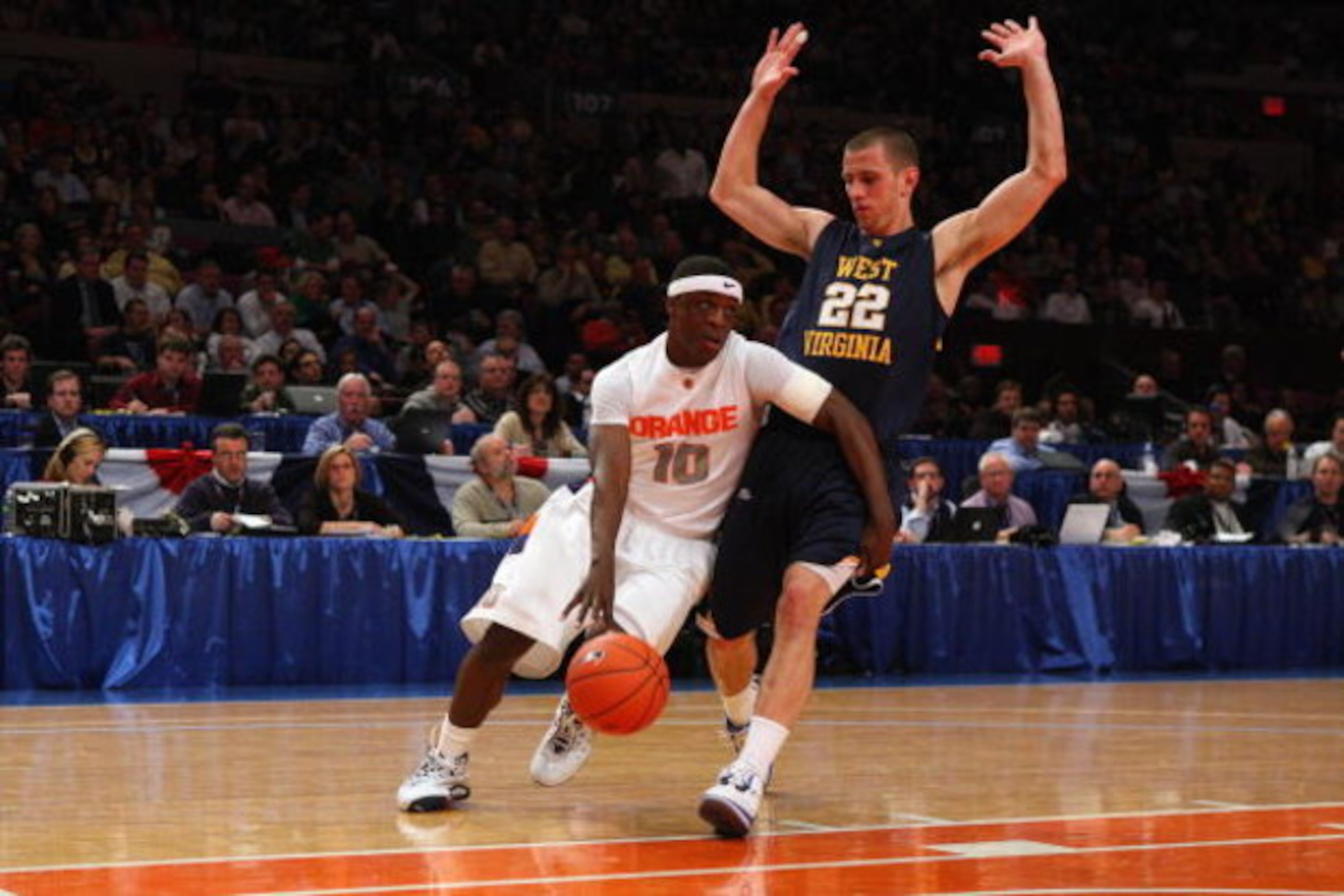 NEW YORK - MARCH 13: Jonny Flynn #10 of the Syracuse Orange dribbles against Alex Ruoff #22 of the West Virginia Mountaineers during the semifinal round of the Big East Tournament at Madison Square Garden on March 13, 2009 in New York City. (Photo by Jim NEW YORK - MARCH 13: Jonny Flynn #10 of the Syracuse Orange dribbles against Alex Ruoff #22 of the West Virginia Mountaineers during the semifinal round of the Big East Tournament at Madison Square Garden on March 13, 2009 in New York City. (Photo by Jim