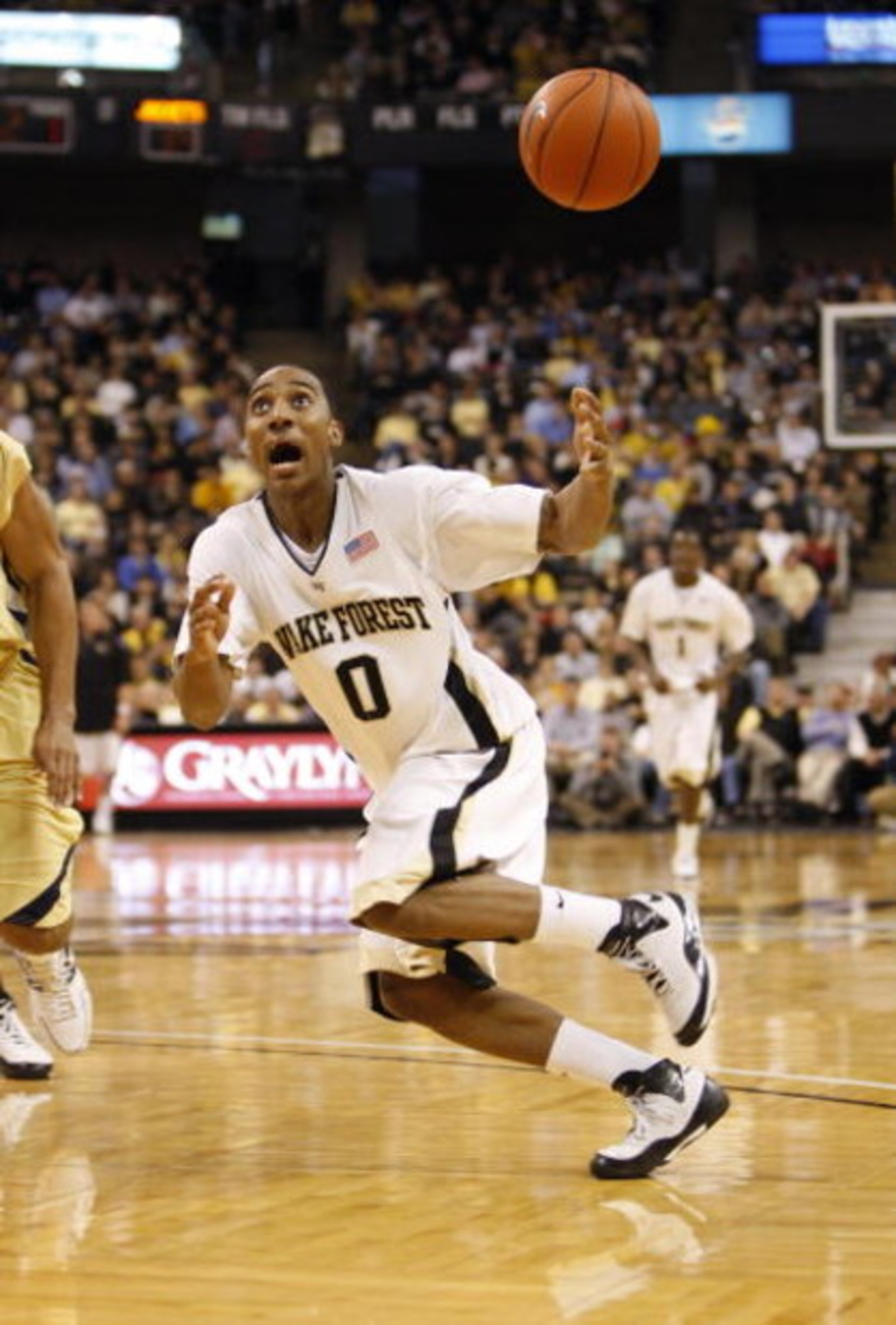 WINSTON-SALEM, NC - FEBRUARY 18: Jeff Teague #0 of the Wake Forest Demon Deacons looks to control the loose ball during their game against the Georgia Tech Yellow Jackets at Lawrence Joel Coliseum on February 18, 2009 in Winston-Salem, North Carolina. Th WINSTON-SALEM, NC - FEBRUARY 18: Jeff Teague #0 of the Wake Forest Demon Deacons looks to control the loose ball during their game against the Georgia Tech Yellow Jackets at Lawrence Joel Coliseum on February 18, 2009 in Winston-Salem, North Carolina. Th