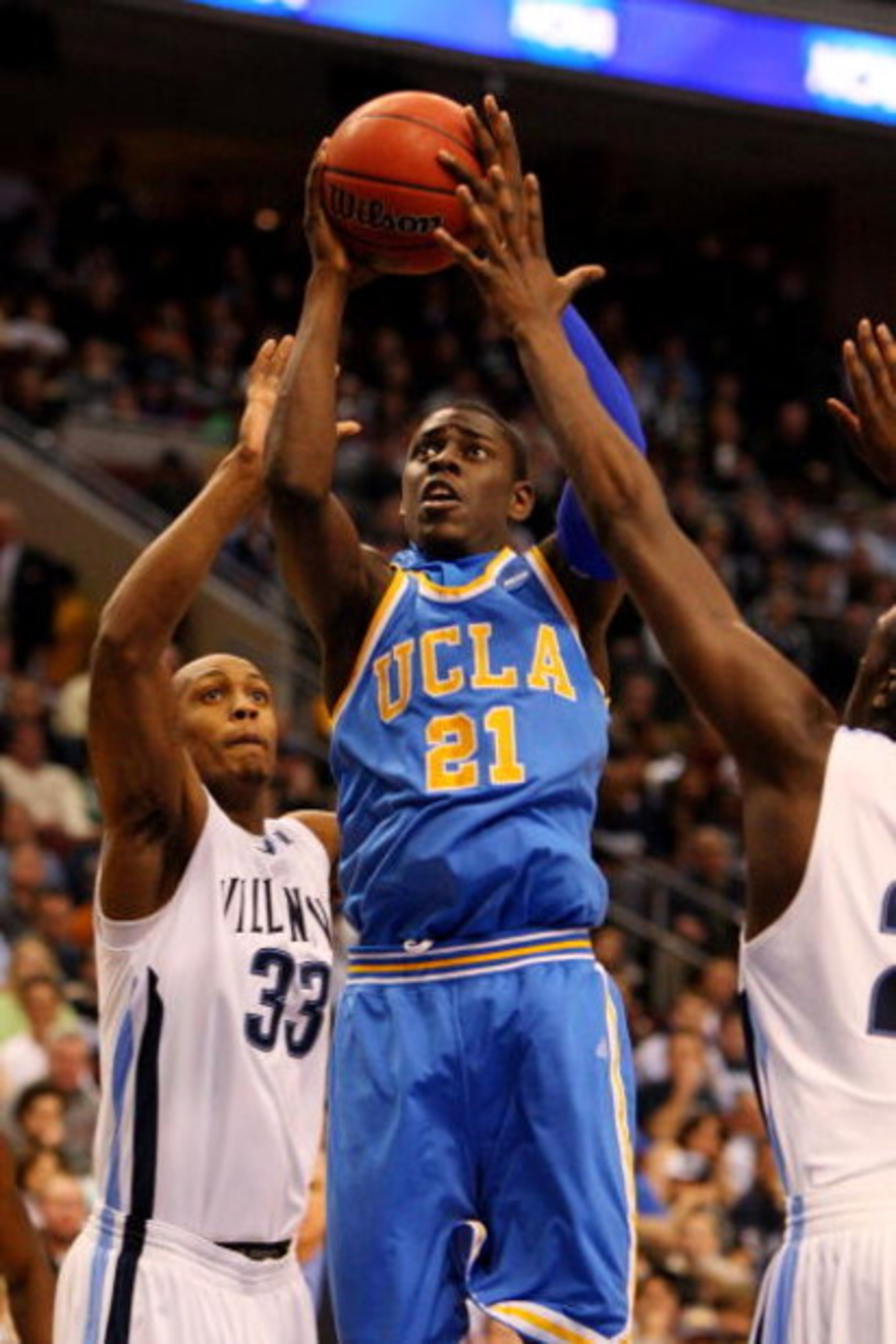PHILADELPHIA - MARCH 21: Jrue Holiday #21 of the UCLA Bruins shoots against Dante Cunningham #33 of the Villanova Wildcats during the second round of the NCAA Division I Men's Basketball Tournament at the Wachovia Center on March 21, 2009 in Philadelphia PHILADELPHIA - MARCH 21: Jrue Holiday #21 of the UCLA Bruins shoots against Dante Cunningham #33 of the Villanova Wildcats during the second round of the NCAA Division I Men's Basketball Tournament at the Wachovia Center on March 21, 2009 in Philadelphia