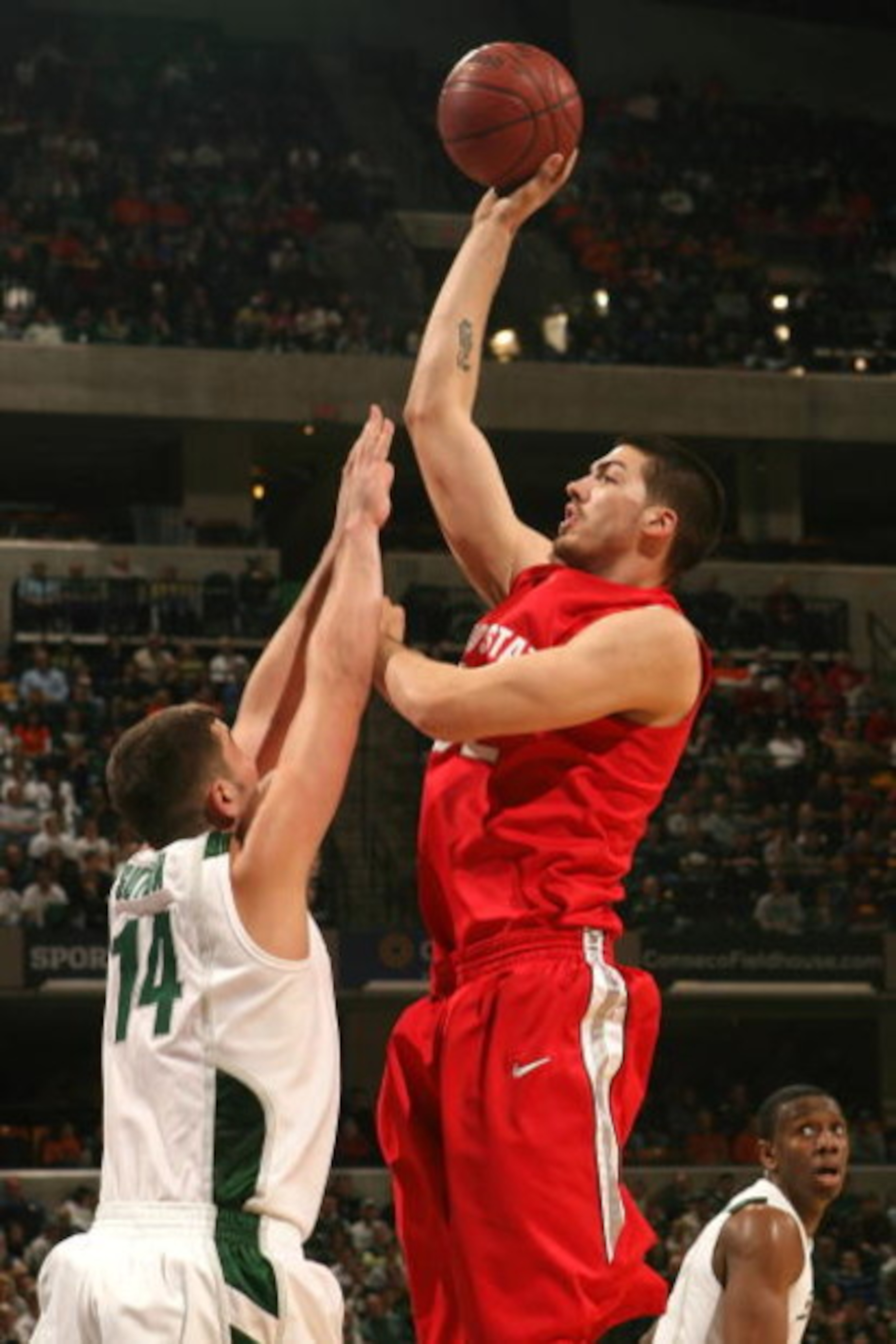 INDIANAPOLIS - MARCH 14: B.J. Mullens #32 of the Ohio State Buckeyes attempts a shot against Goran Suton #14 of the Michigan State Spartans during their semifinal game of the Big Ten Men's Basketball Tournament at Conseco Fieldhouse on March 14, 2009 in INDIANAPOLIS - MARCH 14: B.J. Mullens #32 of the Ohio State Buckeyes attempts a shot against Goran Suton #14 of the Michigan State Spartans during their semifinal game of the Big Ten Men's Basketball Tournament at Conseco Fieldhouse on March 14, 2009 in