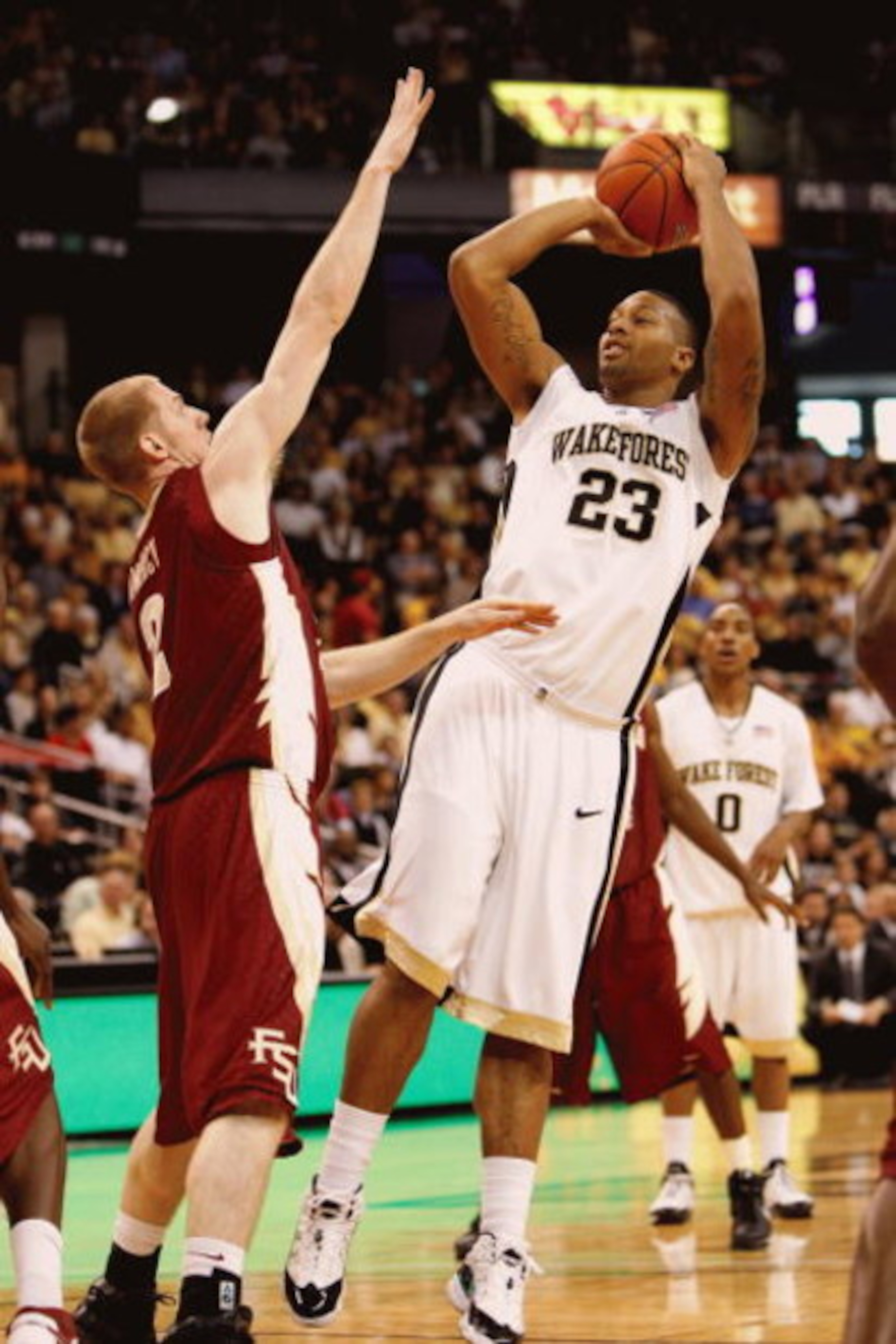 WINSTON-SALEM, NC - FEBRUARY 14: James Johnson #23 of the Wake Forest Demon Deacons shoots against Jordan DeMercy #2 of the Florida State Seminoles during the game at Lawrence Joel Coliseum on February 14, 2009 in Winston-Salem, North Carolina. (Photo by WINSTON-SALEM, NC - FEBRUARY 14: James Johnson #23 of the Wake Forest Demon Deacons shoots against Jordan DeMercy #2 of the Florida State Seminoles during the game at Lawrence Joel Coliseum on February 14, 2009 in Winston-Salem, North Carolina. (Photo by