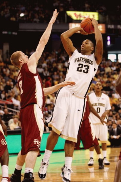 WINSTON-SALEM, NC - FEBRUARY 14:  James Johnson #23 of the Wake Forest Demon Deacons shoots against Jordan DeMercy #2 of the Florida State Seminoles during the game at Lawrence Joel Coliseum on February 14, 2009 in Winston-Salem, North Carolina. (Photo by