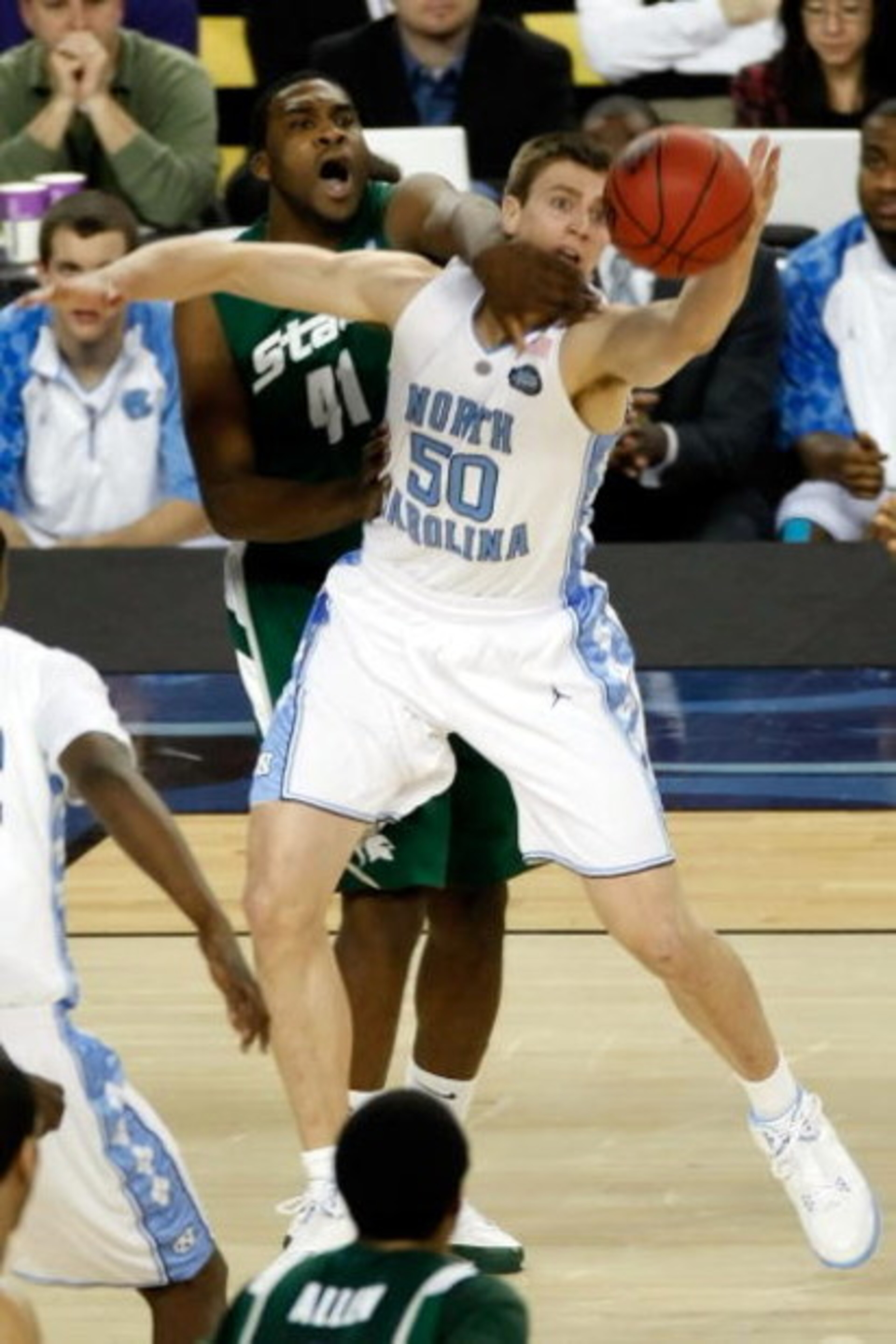 DETROIT - APRIL 06: Marquise Gray #41 of the Michigan State Spartans and Tyler Hansbrough #50 of the North Carolina Tar Heels battle for the ball in the first half during the 2009 NCAA Division I Men's Basketball National Championship game at Ford Field DETROIT - APRIL 06: Marquise Gray #41 of the Michigan State Spartans and Tyler Hansbrough #50 of the North Carolina Tar Heels battle for the ball in the first half during the 2009 NCAA Division I Men's Basketball National Championship game at Ford Field
