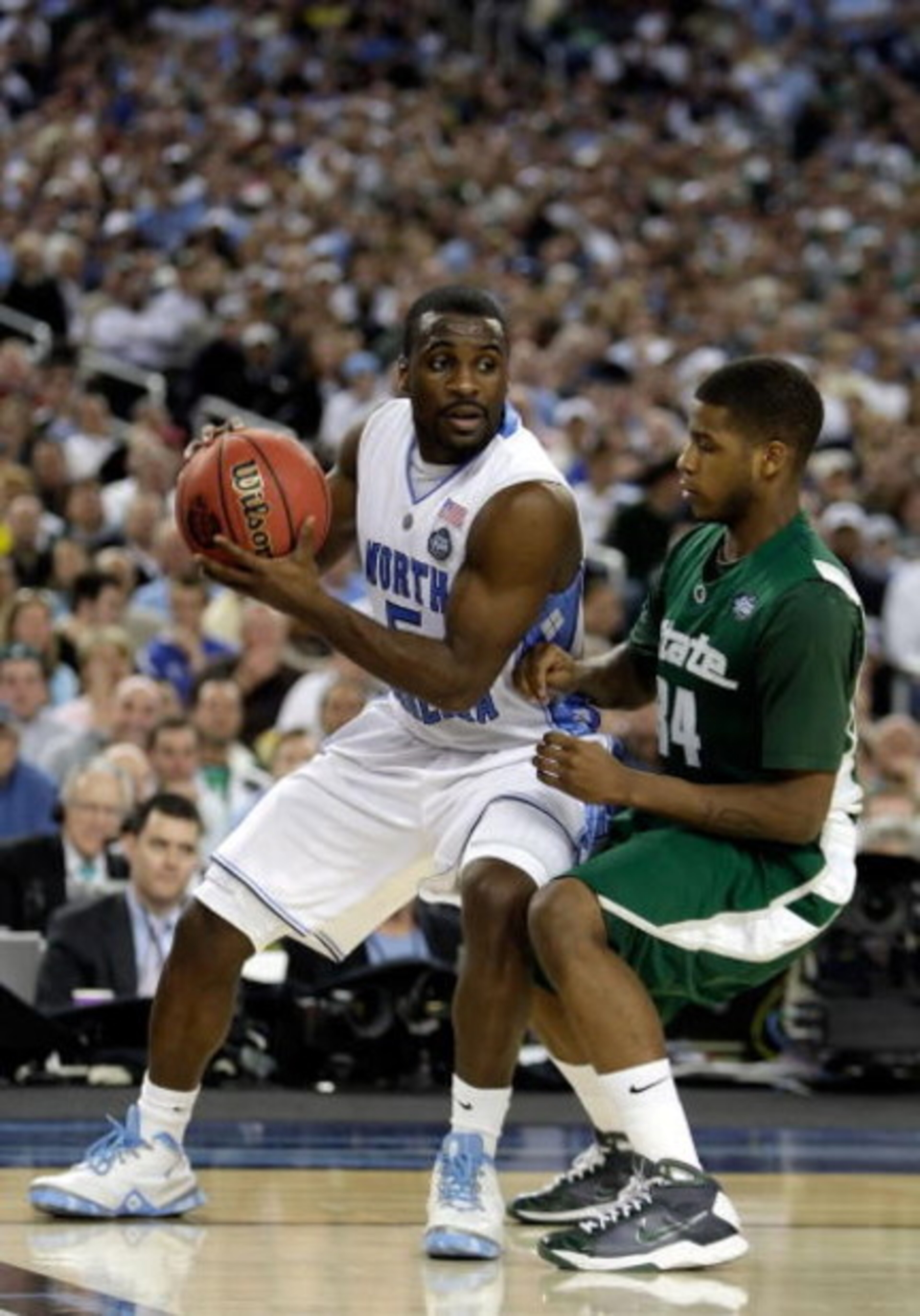 DETROIT - APRIL 06: Ty Lawson #5 of the North Carolina Tar Heels looks to drive on Korie Lucious #34 of the Michigan State Spartans during the 2009 NCAA Division I Men's Basketball National Championship game at Ford Field on April 6, 2009 in Detroit, Mi DETROIT - APRIL 06: Ty Lawson #5 of the North Carolina Tar Heels looks to drive on Korie Lucious #34 of the Michigan State Spartans during the 2009 NCAA Division I Men's Basketball National Championship game at Ford Field on April 6, 2009 in Detroit, Mi