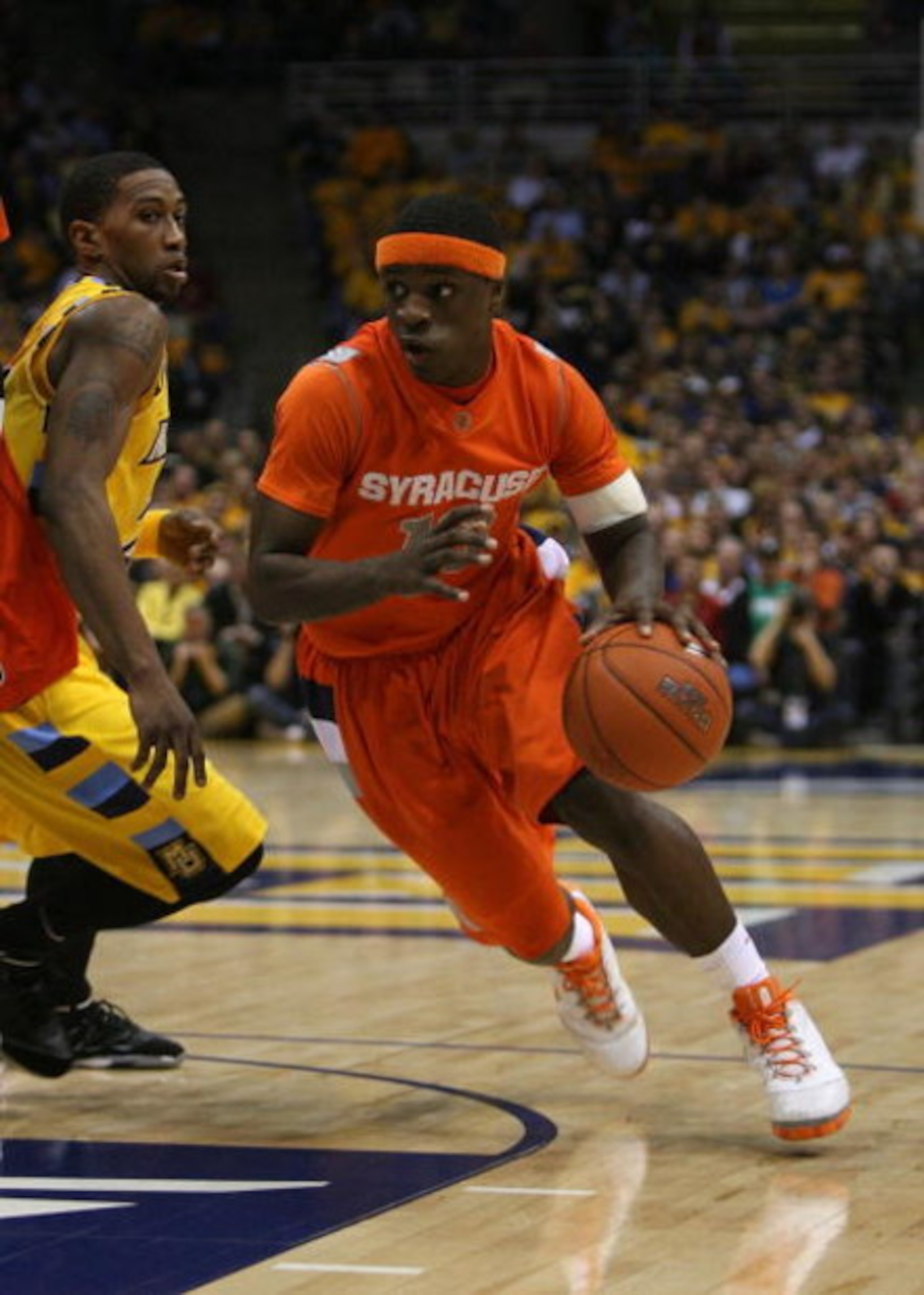 MILWAUKEE - MARCH 07: Jonny Flynn #10 of the Syracuse Orange drives around Jerel McNeal #22 of the Marquette Golden Eagles on March 7, 2009 at the Bradley Center in Milwaukee, Wisconsin. Syracuse defeated Marquette 86-79 in overtime. (Photo by Jonathan Da
