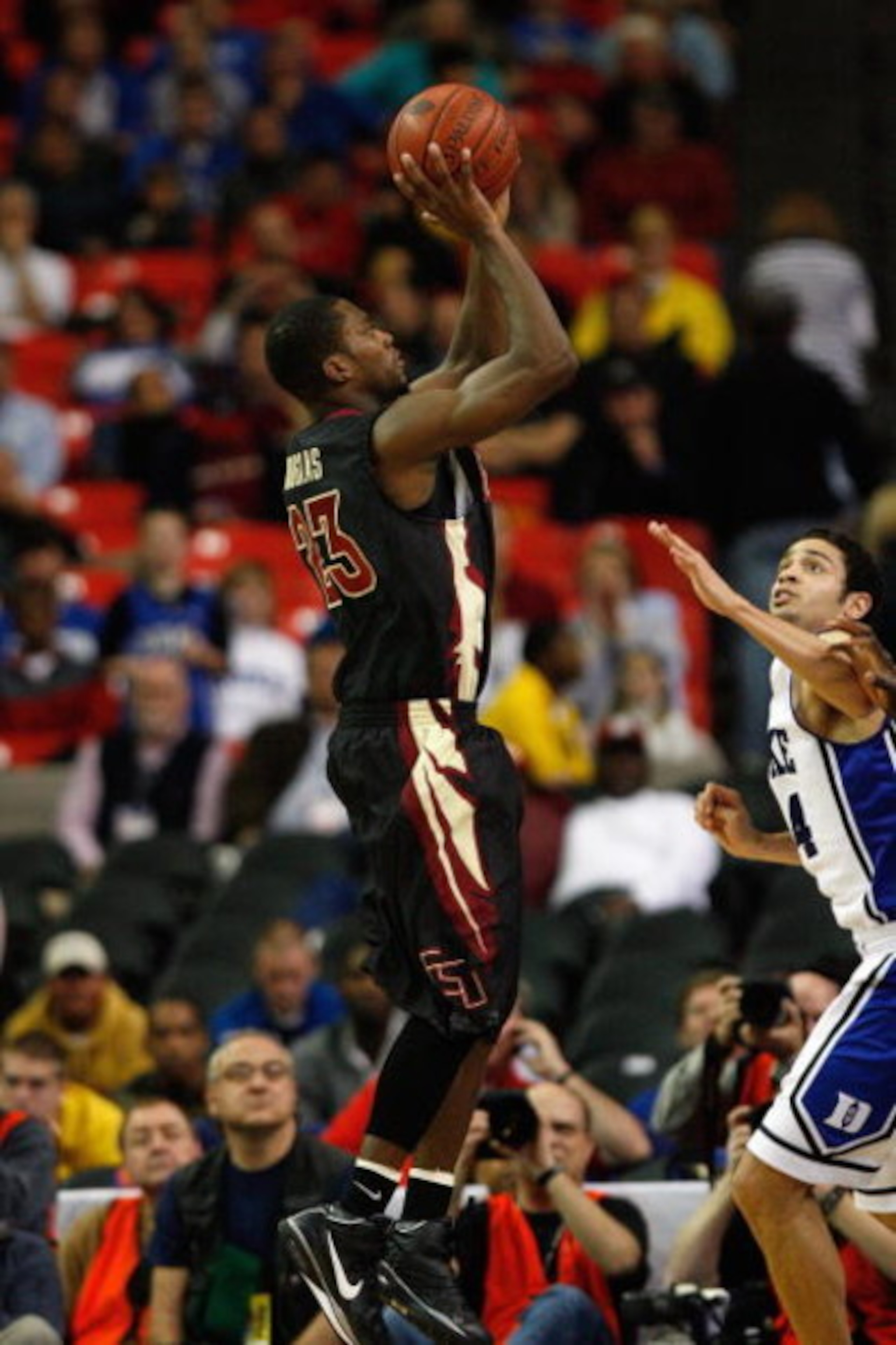 ATLANTA - MARCH 15:  Toney Douglas #23 of the Florida State Seminoles shoots a jump shot against David McClure #14 of the Duke Blue Devils during the championship game of the 2009 ACC Men's Basketball Tournament on March 15, 2009 at the Georgia Dome in At