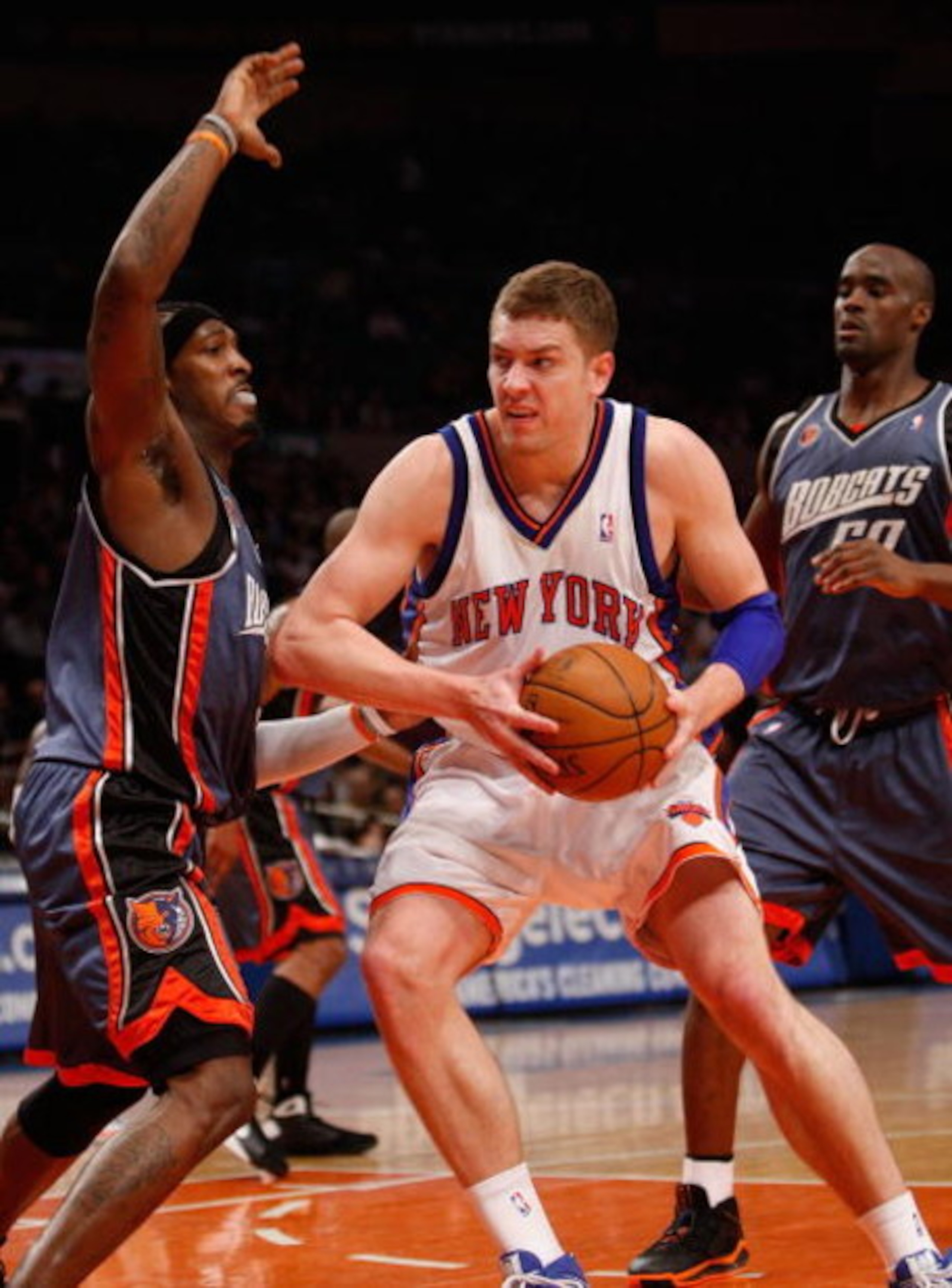 NEW YORK - MARCH 07:  David Lee #42 of the New York Knicks drives to the basket against the Charlotte Bobcats on March 7, 2009 at Madison Square Garden in New York City. NOTE TO USER: User expressly acknowledges and agrees that, by downloading and or usin