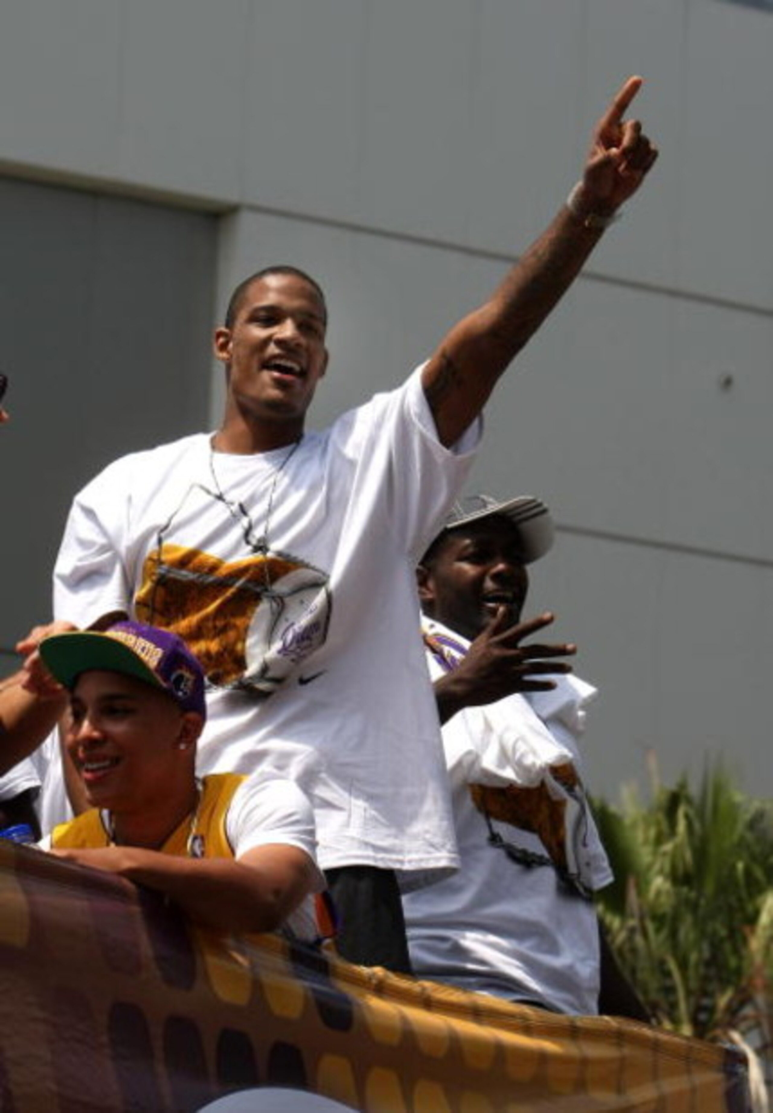LOS ANGELES, CA - JUNE 17:  Trevor Ariza #3  waves to the crowd from the top of a double decker bus at the start of Los Angeles Lakers NBA championship victory parade outside the Staples Center on June 17, 2009 in Los Angeles, California.  (Photo by Steph