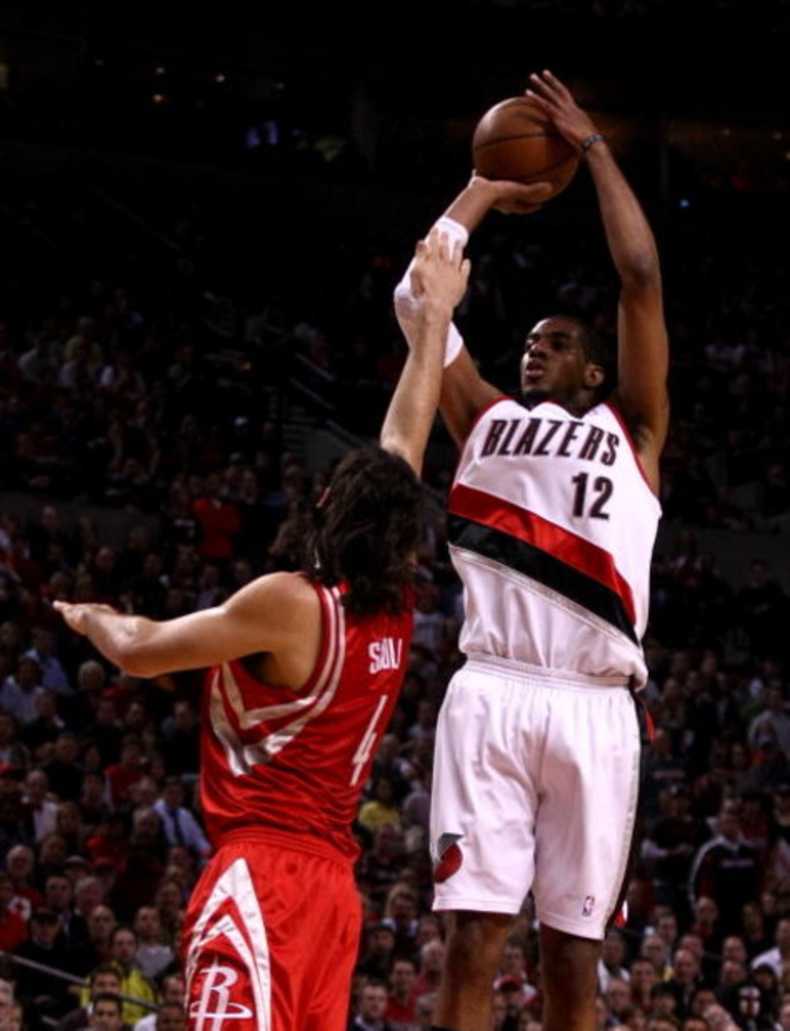 PORTLAND, OR - APRIL 28:  LaMarcus Aldridge #12 of the Portland Trail Blazers shoots against Luis Scola #4 of the Houston Rockets during Game 5 of the Western Conference Quarterfinals of the NBA Playoffs on April 28, 2009 at the Rose Garden in Portland, O