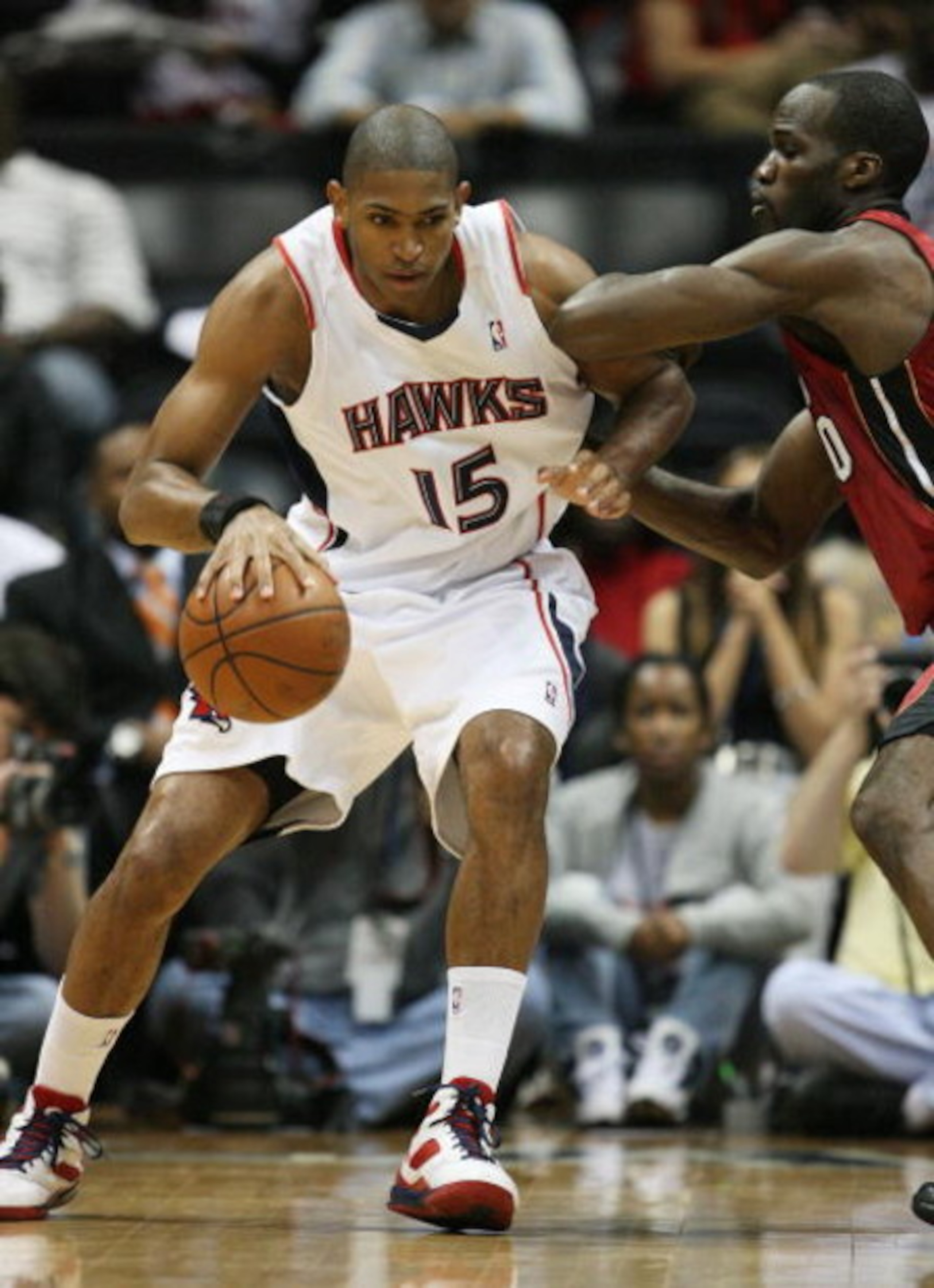 ATLANTA - MAY 03:  Al Horford #15 of the Atlanta Hawks backs down Joel Anthony #50 of the Miami Heat during Game Seven of the Eastern Conference Quarterfinals at Philips Arena on May 3, 2009 in Atlanta, Georgia. The Hawks defeated the Heat 91-78. NOTE TO 