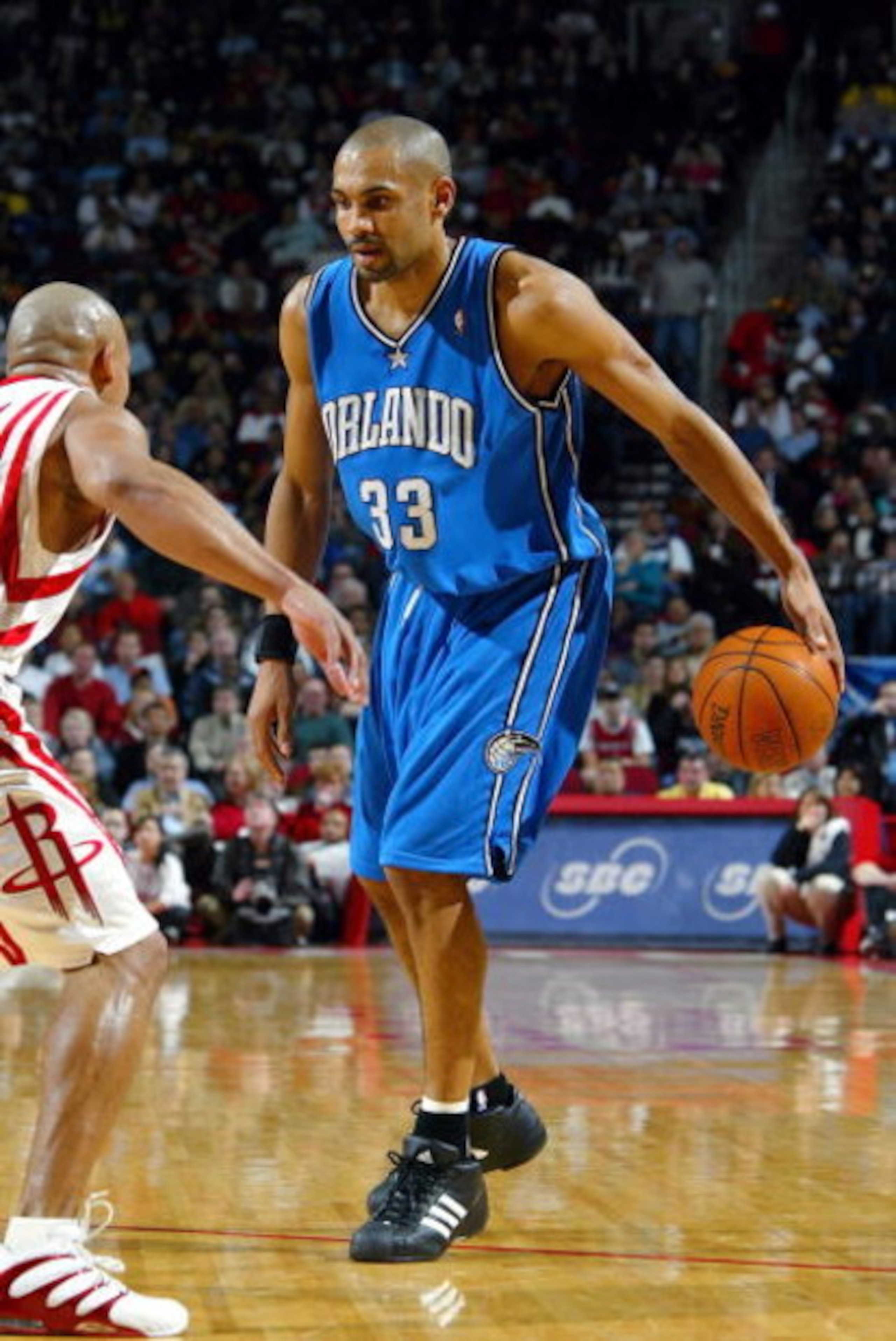 DALLAS - JANUARY 24:  Grant Hill #33 of the Orlando Magic dribbles during a game against the Houston Rockets on January 24, 2005 at the Toyota Center in Houston, Texas. The Rockets defeated the Magic 89-78.  NOTE TO USER:User expressly acknowleges and agr