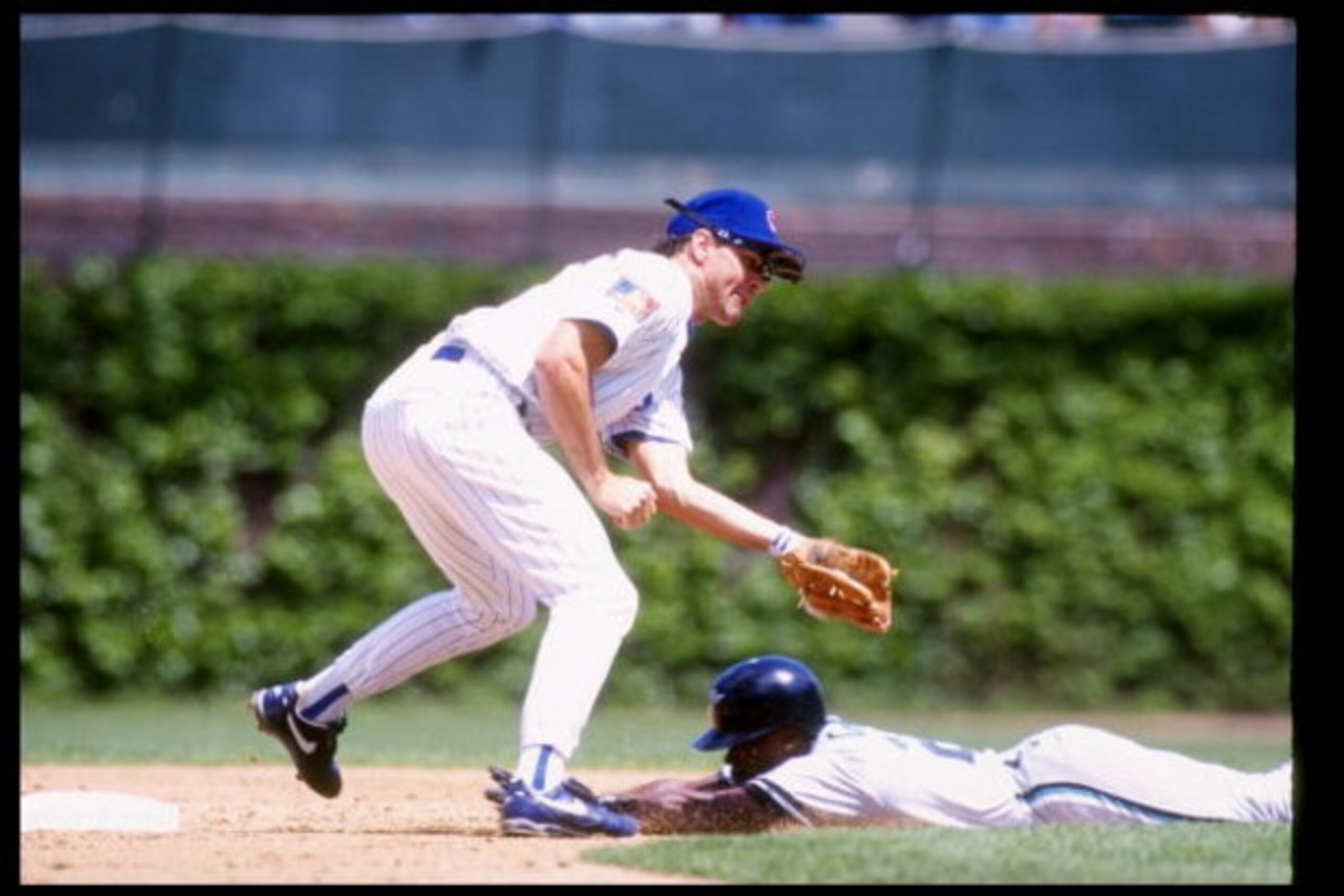 CHICAGO - May 15: Second baseman Ryne Sandberg of the Chicago Cubs tags out someone during a game against the Florida Marlins on May 14, 1994 at Wrigley Field in Chicago, Illinois. (Photo by Jonathan Daniel/Getty Images)
