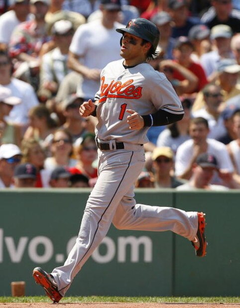 BOSTON - AUGUST 2:  Brian Roberts #1 of the Baltimore Orioles scores a run against the Boston Red Sox on August 2, 2007 at Fenway Park in Boston, Massachusetts. (Photo by Jim Rogash/Getty Images)  