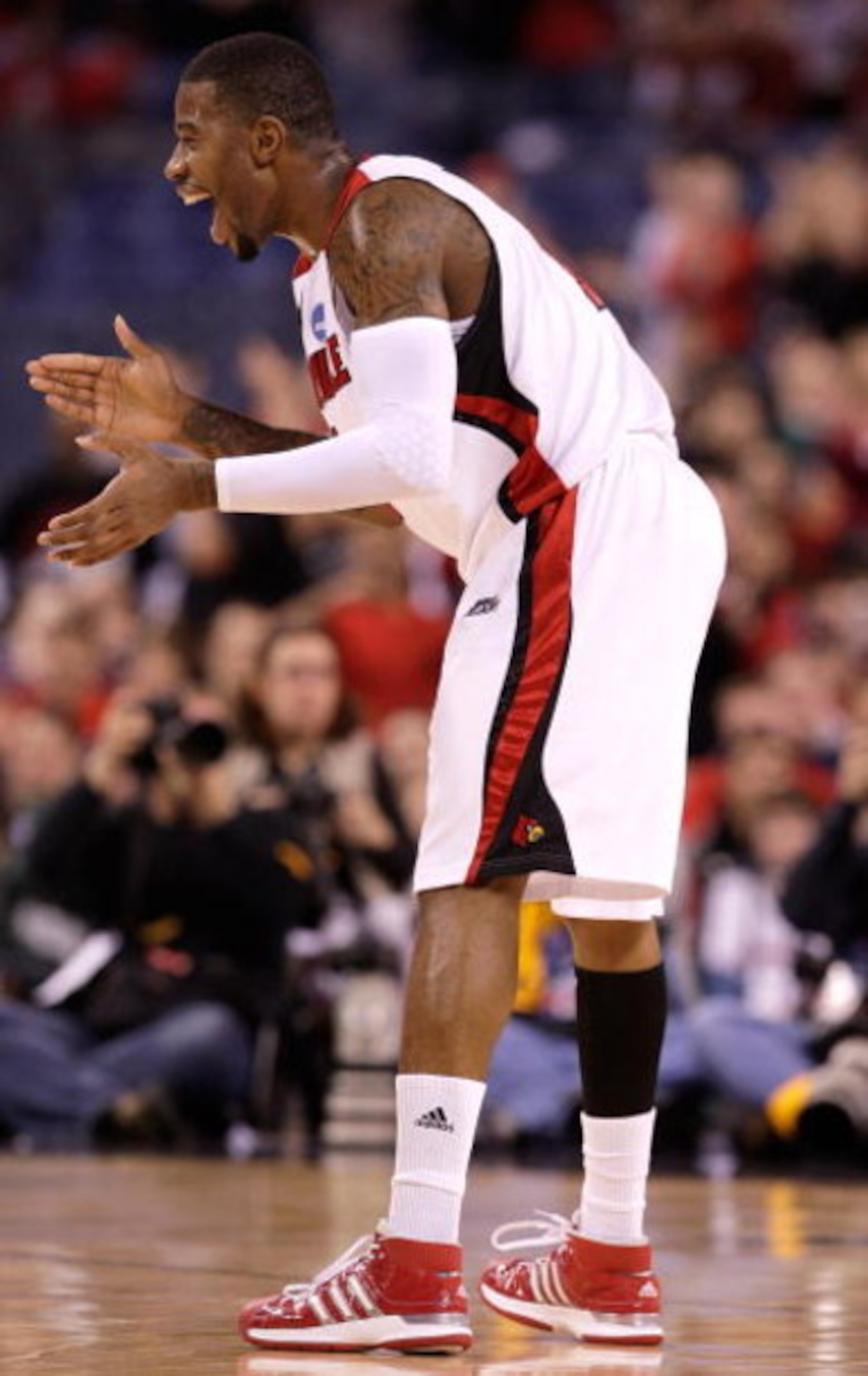 INDIANAPOLIS - MARCH 29:  Terrence Williams #1 of the Louisville Cardinals celebrates a play in the first half against the Michigan State Spartans during the fourth round of the NCAA Division I Men's Basketball Tournament at the Lucas Oil Stadium on March