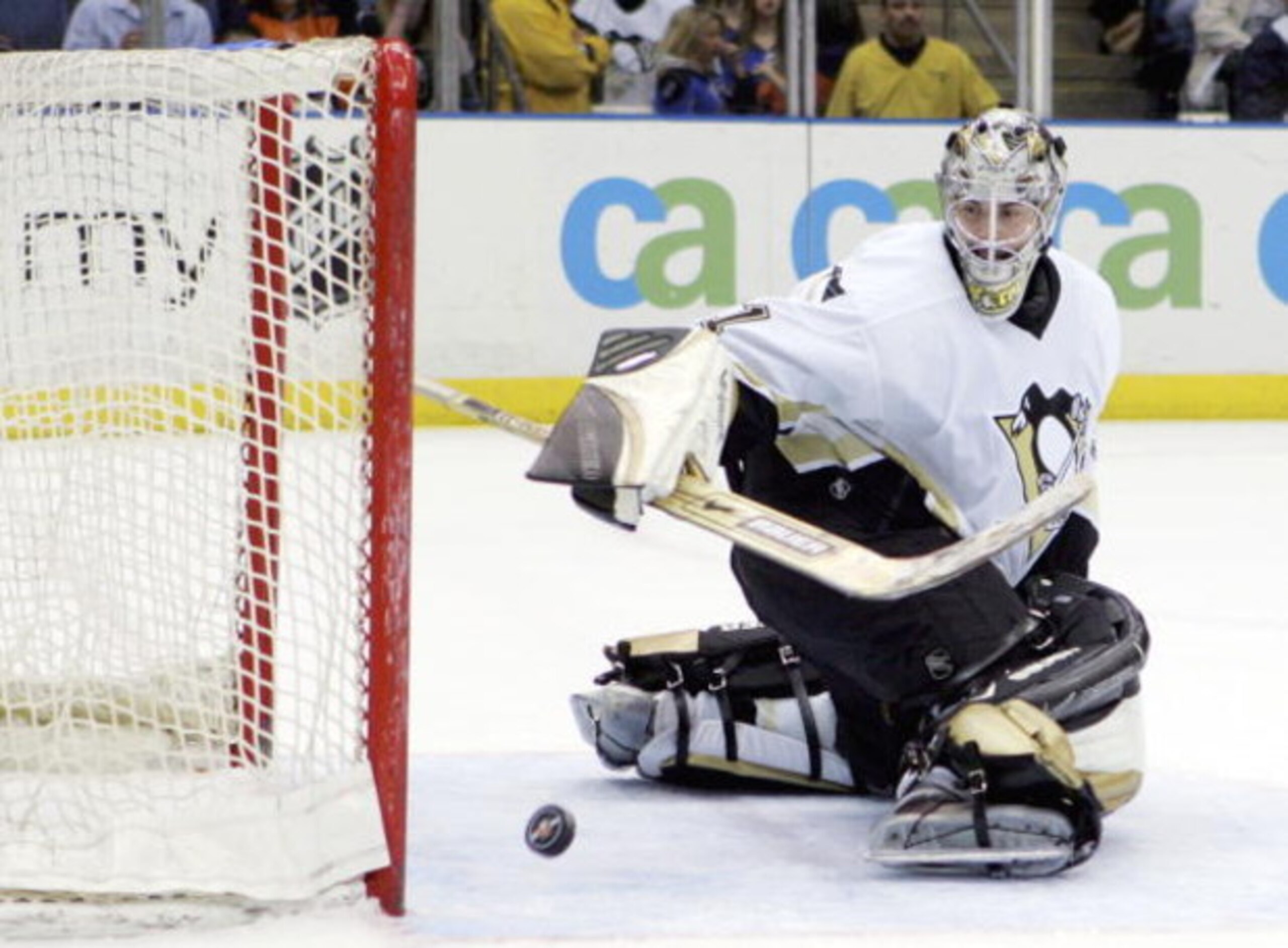 UNIONDALE, NY - APRIL 15:  Sebastien Caron #31 of the Pittsburgh Penguins watches the puck after making a save against the New York Islanders on April 15, 2006 at the Nassau Coliseum in Uniondale, New York. The Isles defeated the Pens 5-4 after a shootout