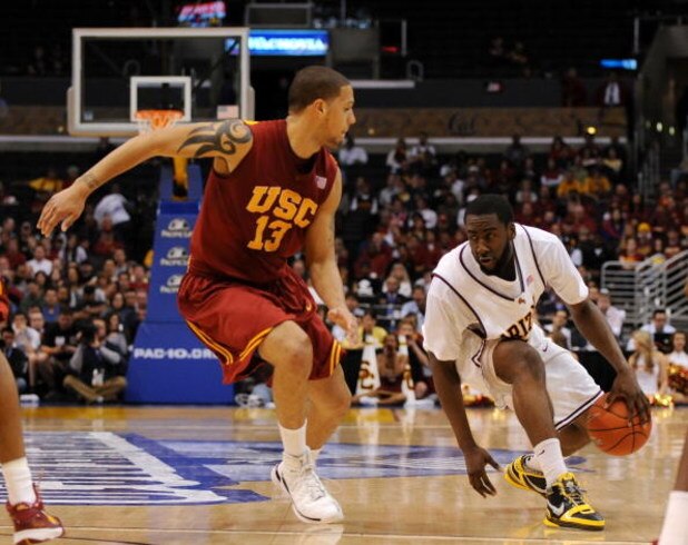 LOS ANGELES, CA - MARCH 14:  Guard James Harden #13 of the Arizona State Sun Devils drives against guard Daniel Hackett #13 of the USC Trojans in the Pacific Life Pac-10 Men's Basketball Tournament Championship Game at the Staples Center on March 14, 2009