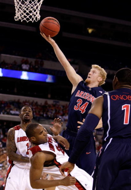 INDIANAPOLIS - MARCH 27:  Chase Budinger #34 of the Arizona Wildcats drives for a shot attempt against the Louisville Cardinals  during the third round of the NCAA Division I Men's Basketball Tournament at the Lucas Oil Stadium on March 27, 2009 in Indian