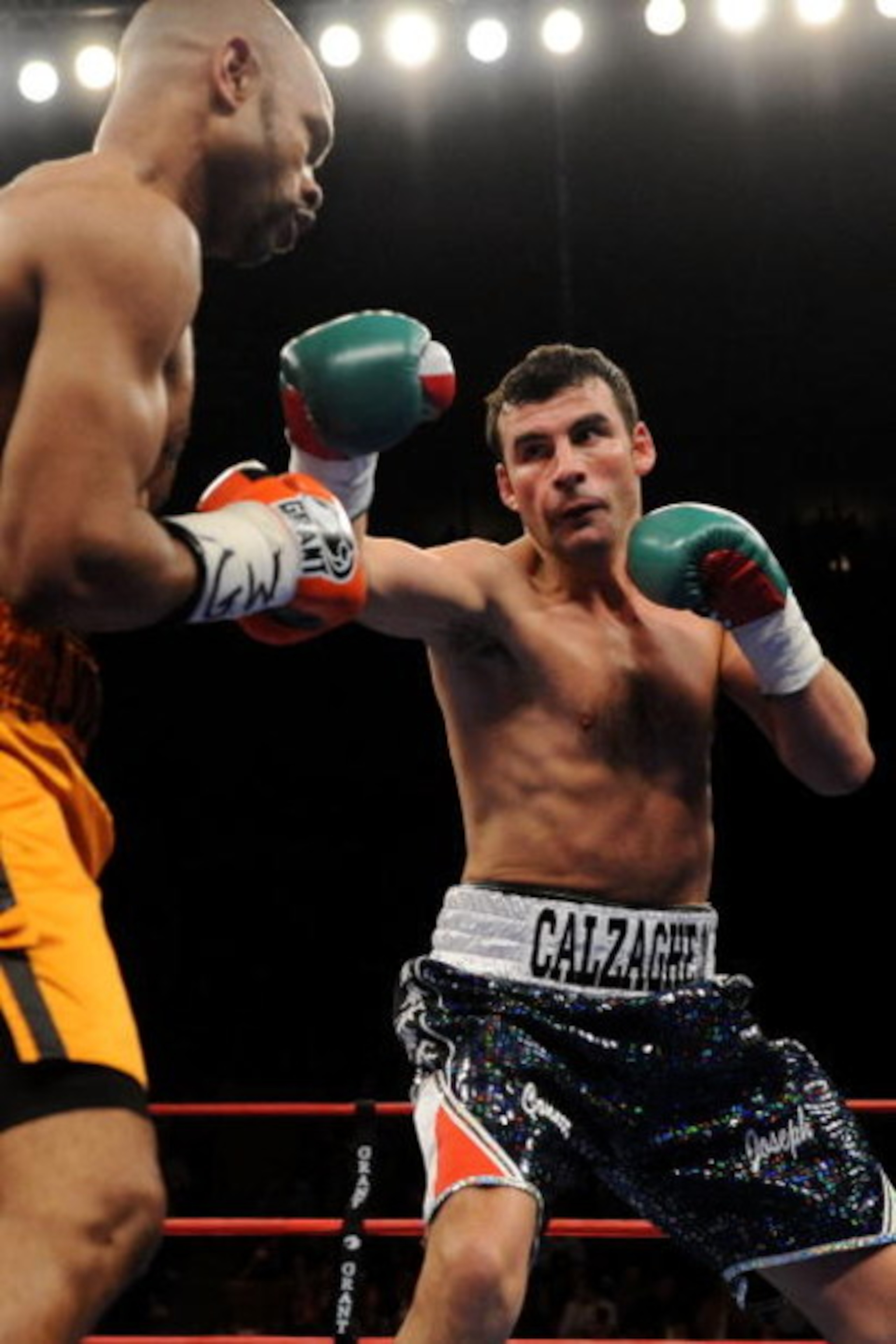 NEW YORK - NOVEMBER 08:  Joe Calzaghe (R) punches Roy Jones Jr (L) during their Ring Magazine Light Heavyweight Championship bout at Madison Square Garden November 8, 2008 in New York City.  (Photo by Al Bello/Getty Images)