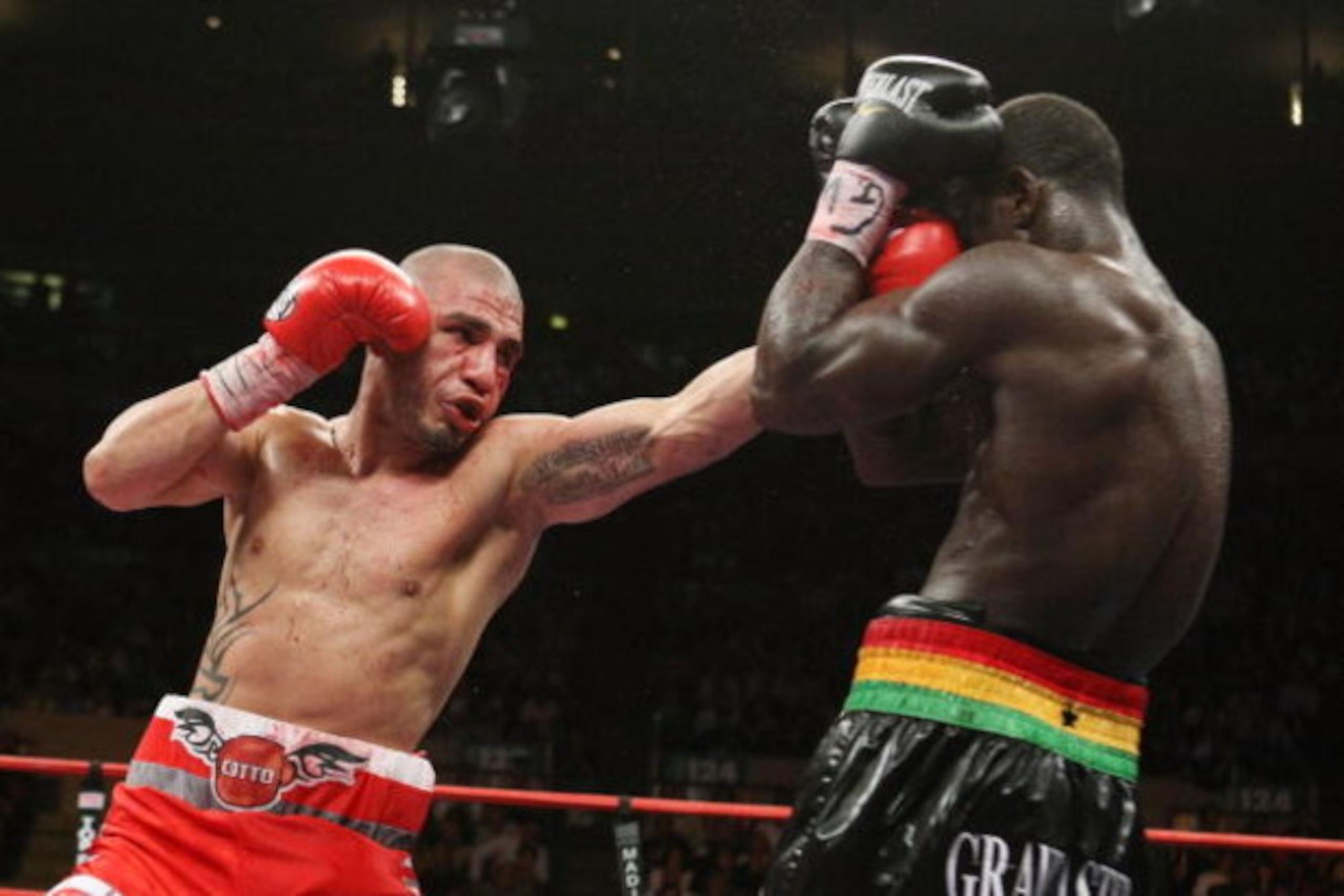 NEW YORK - JUNE 13:  Miguel Cotto punches Joshua Clottey during their WBO Welterweight title fight at Madison Square Garden  on June 13, 2009 in New York, New York.  (Photo by Al Bello/Getty Images)