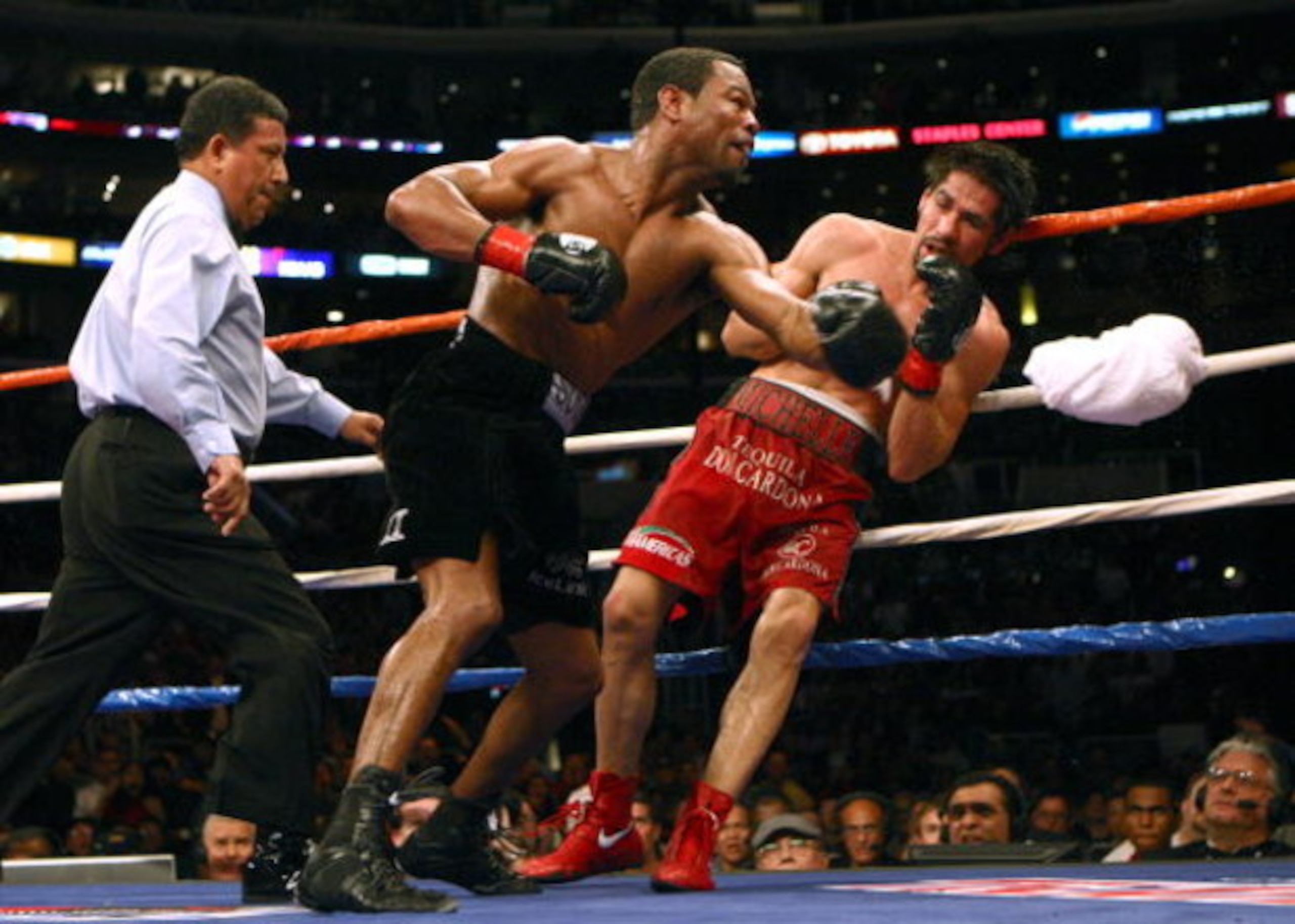 LOS ANGELES - JANUARY 24:   Shane Mosley lands a punch on Antonio Margarito as Margarito's corner throws in the towel en route to a TKO in the ninth round during their WBA welterweight title fight on January 24, 2009 at the Staples Center in Los Angeles, 