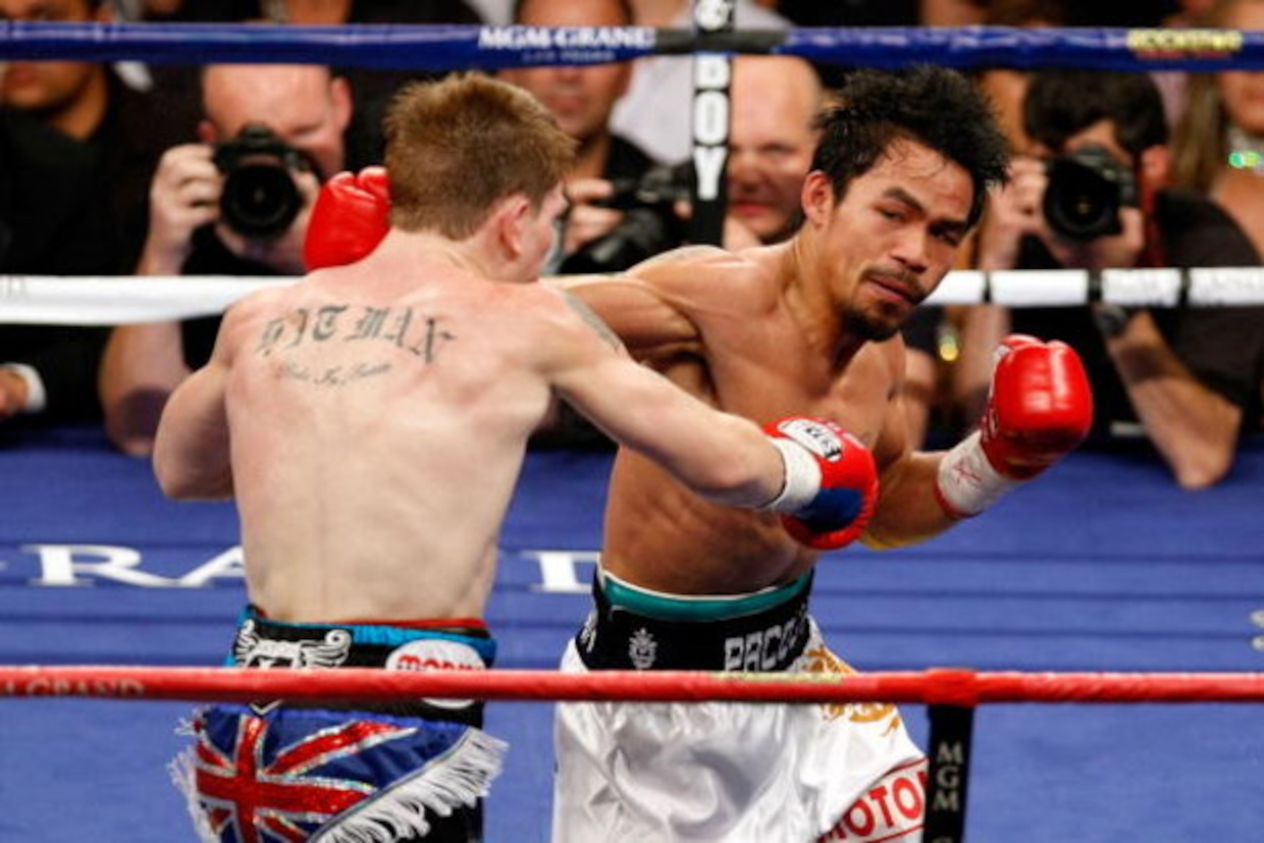 LAS VEGAS - MAY 02:  (R-L) Manny Pacquiao of the Philippines connects with a right to the head of Ricky Hatton of England in their junior welterweight title fight at the MGM Grand Garden Arena May 2, 2009 in Las Vegas, Nevada. Pacquiao defeated Hatton by 