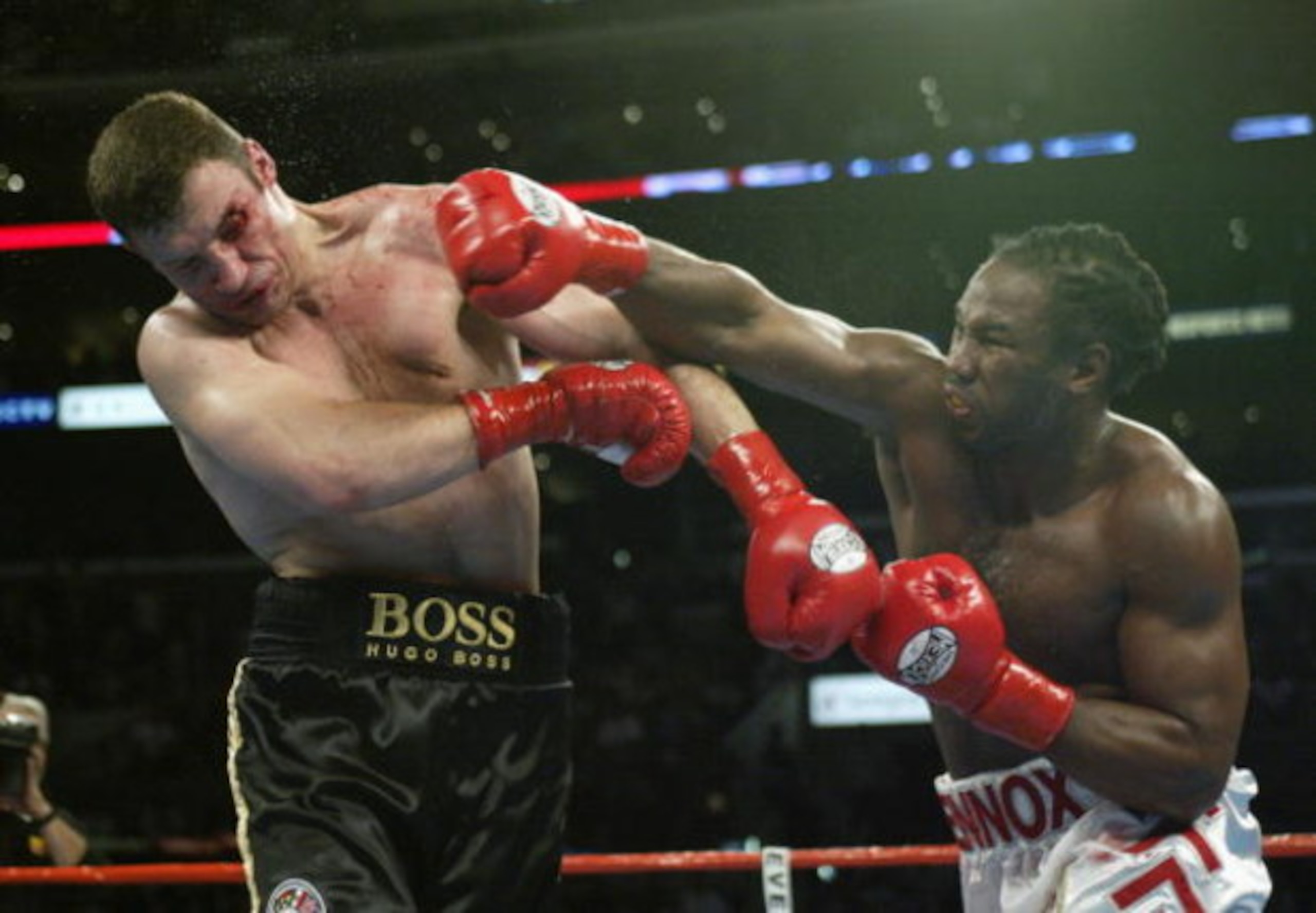LOS ANGELES - JUNE 21:  Lennox Lewis (right) hits Vitali Klitschko (left) during their WBC and IBO World Heavyweight Championship bout at the Staples Center on June 21, 2003 in Los Angeles, California.  Lennox Lewis (41-2-1) defeated Vitali Klitschko (32-