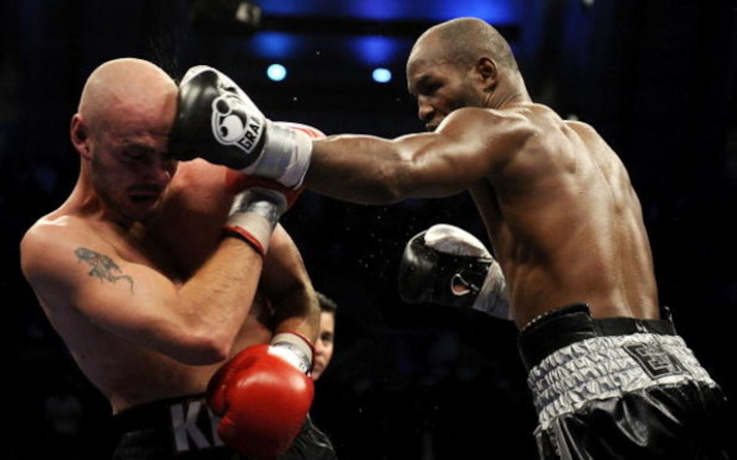 ATLANTIC CITY, NJ - OCTOBER 18:  Bernard Hopkins of Philadelphia,  Pennsylvania (R) connects with a jab to Kelly Pavlik of Youngstown, Ohio during their light heavyweight bout at Boardwalk Hall on October 18, 2008 in Atlantic City, New Jersey.  (Photo by 