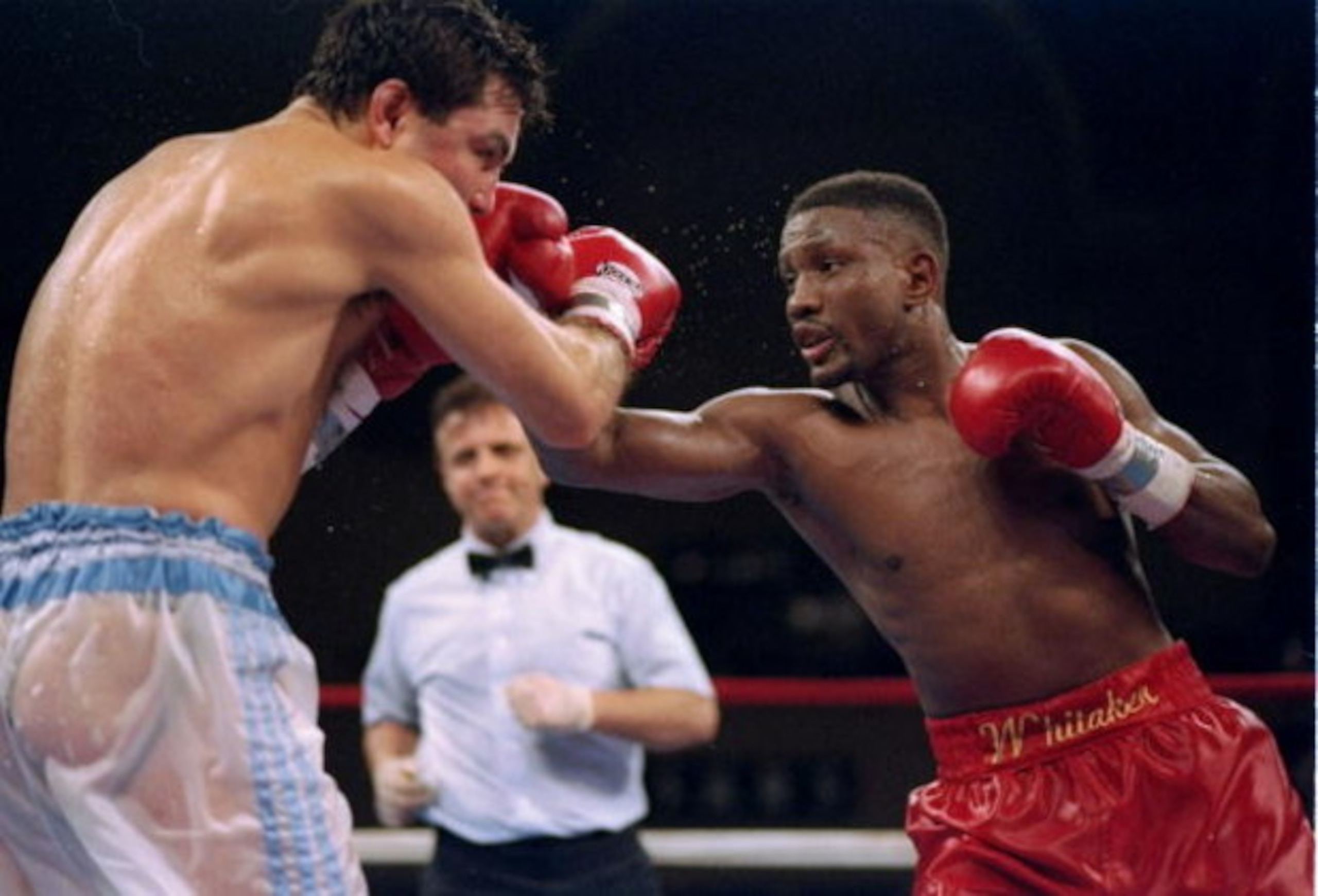 3 Apr 1995:  Pernell Whitaker throws a punch at Julio Cezar Vasquez during a fight.  Mandatory Credit: Simon Bruty  /Allsport