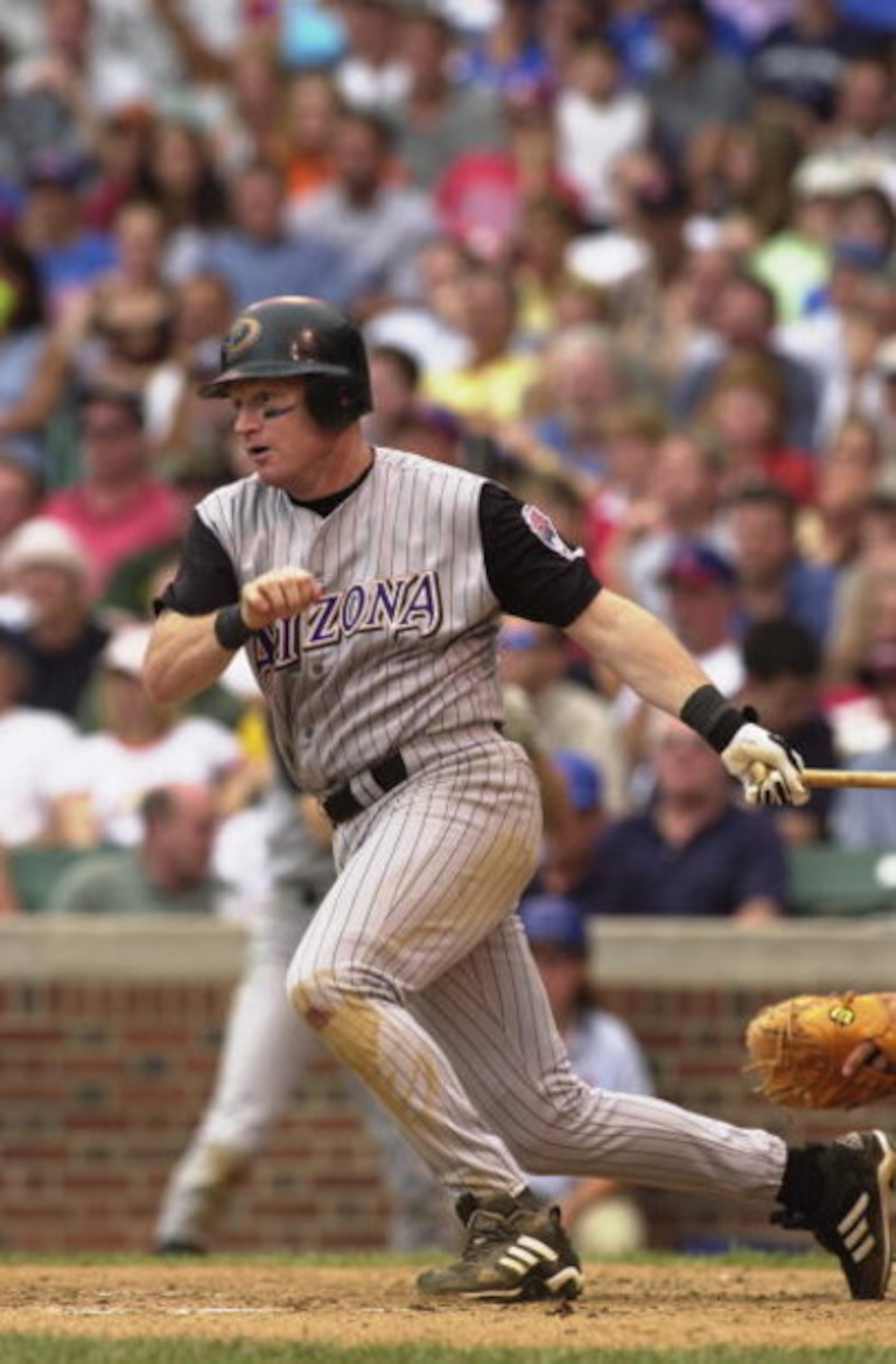 CHICAGO - AUGUST 16:  Third baseman Matt Williams #9 of the Arizona Diamondbacks runs out of the batter's box during the MLB game against the Chicago Cubs on August 16, 2002 at Wrigley Field in Chicago, Illinois.  The Diamondbacks defeated the Cubs 2-1.  