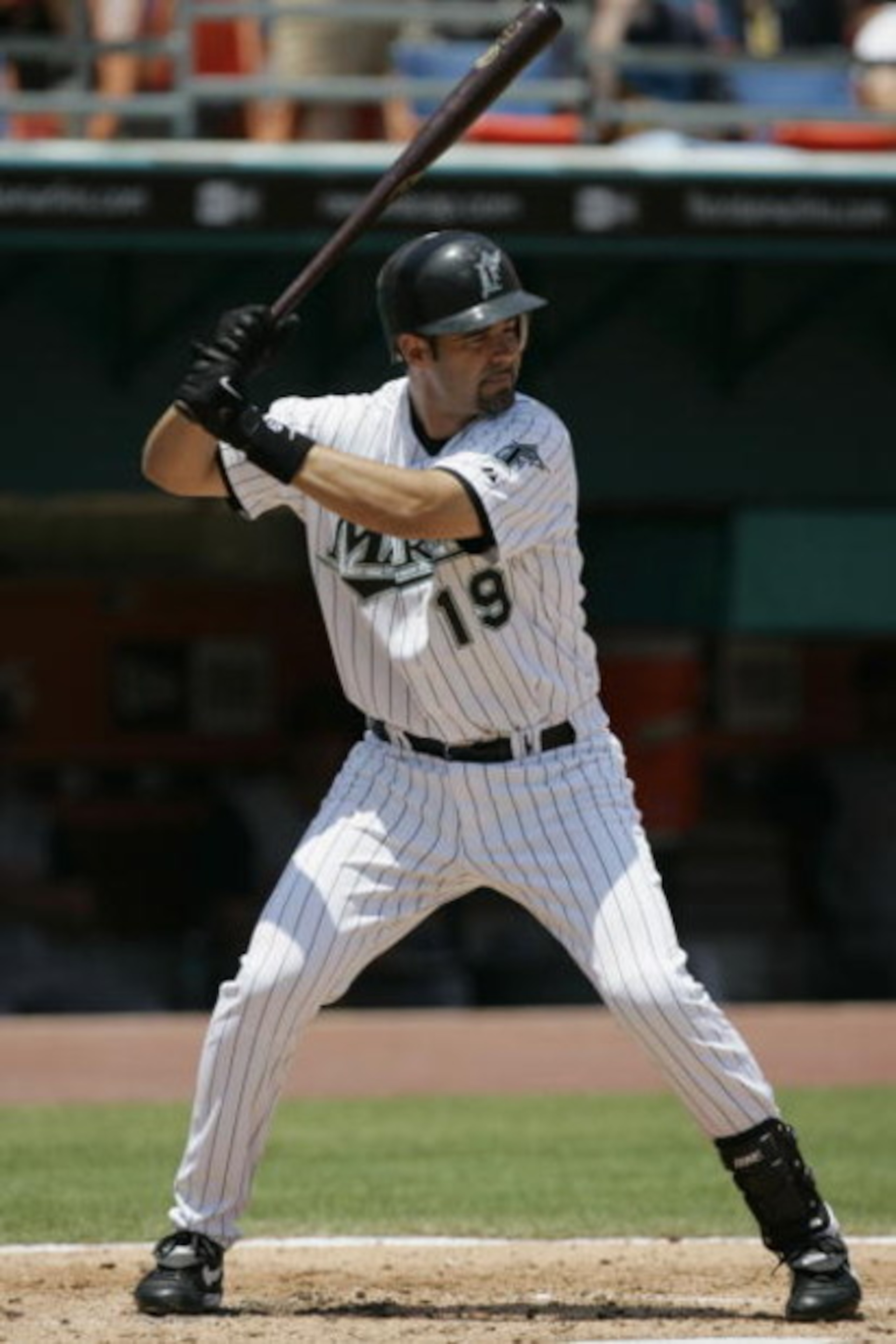 MIAMI - APRIL 23:  Mike Lowell #19 of the Florida Marlins waits for the pitch against the Cincinnati Reds on April 23, 2005 at Dolphins Stadium in Miami, Florida. (Photo by Eliot J. Schechter/Getty Images)