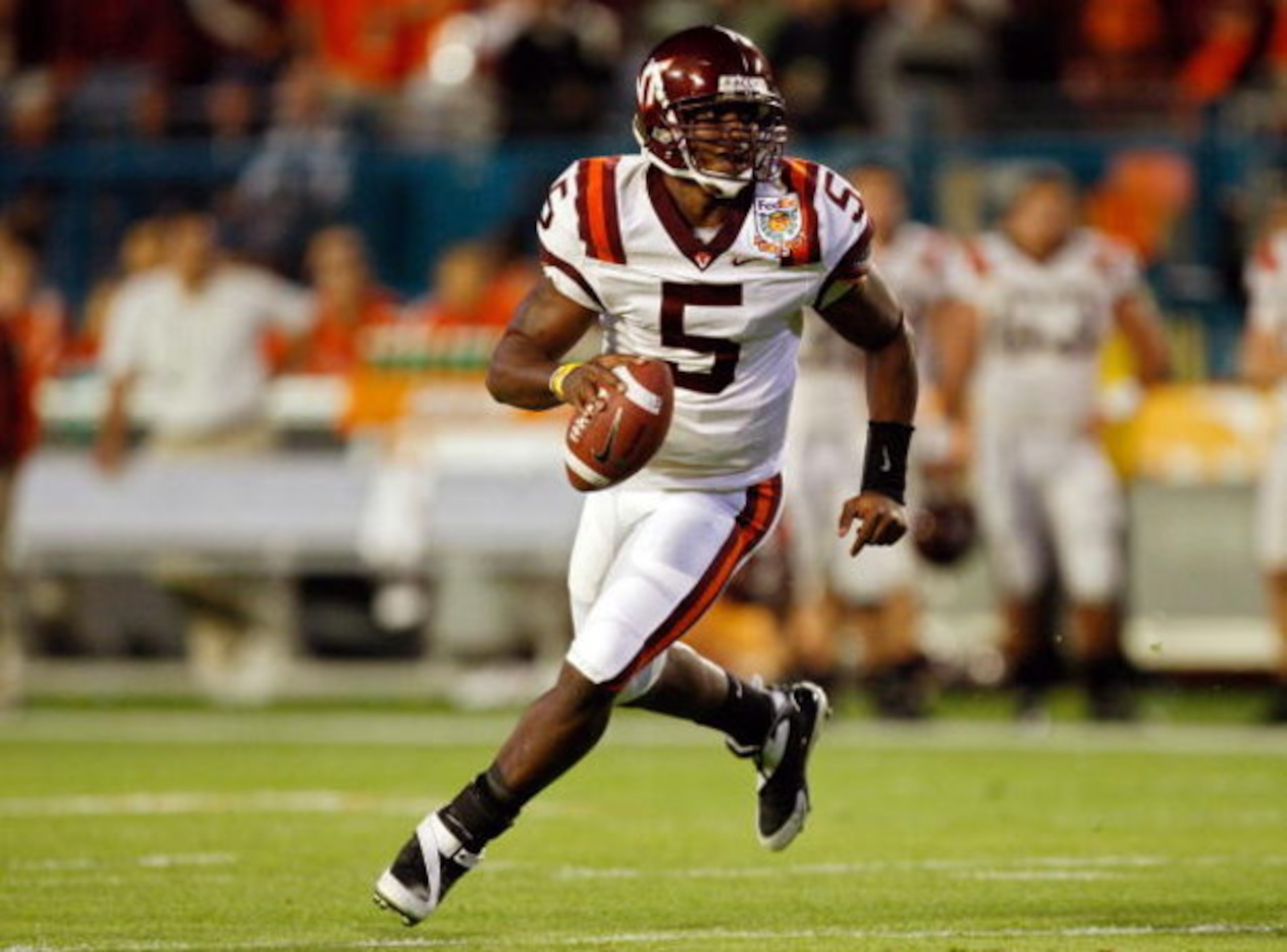 MIAMI - JANUARY 01:  Tyrod Taylor #5 of the Virginia Tech Hokies runs with the ball during the FedEx Orange Bowl against the Cincinnati Bearcats at Dolphin Stadium on January 1, 2009 in Miami, Florida.  (Photo by Streeter Lecka/Getty Images)