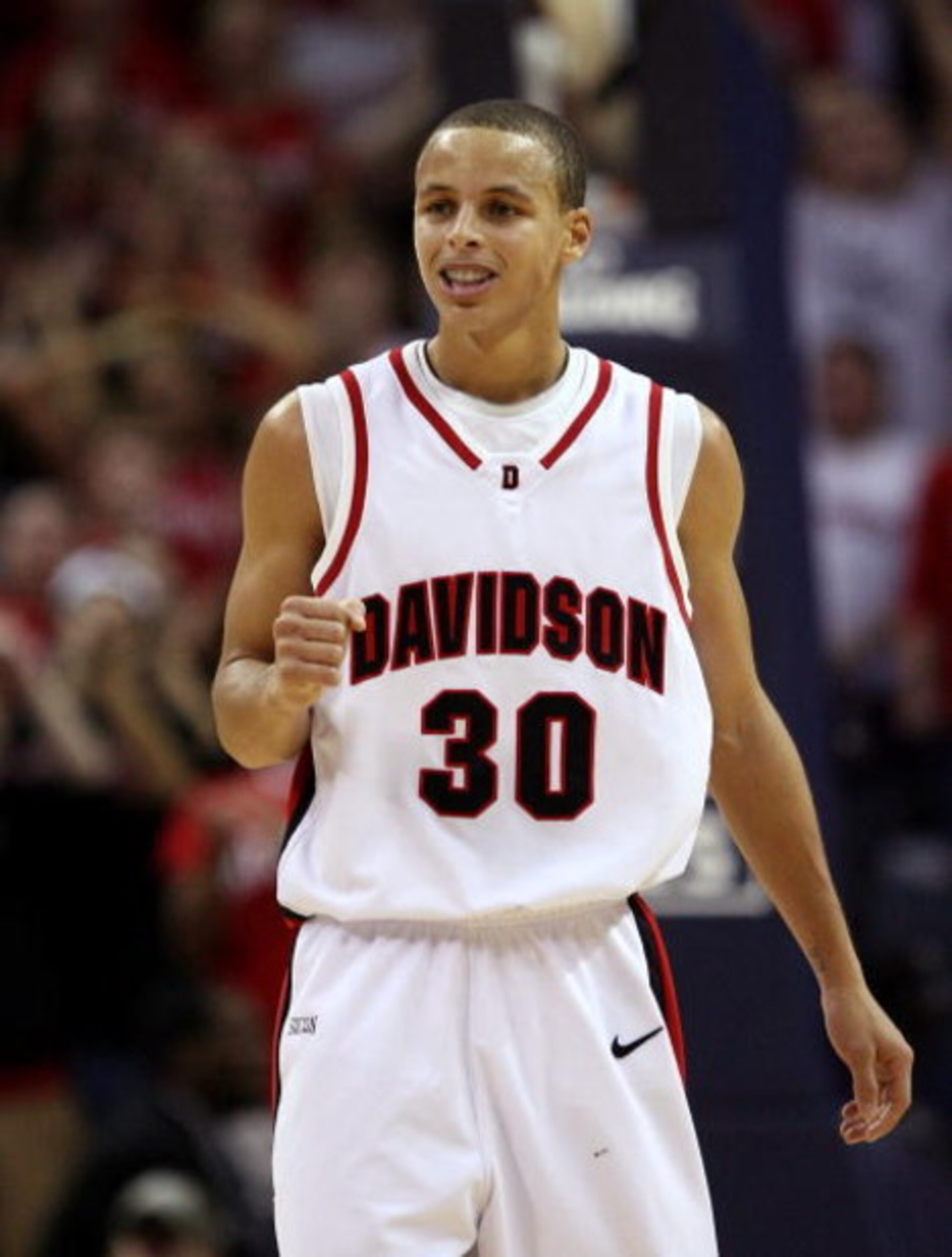 CHARLOTTE, NC - DECEMBER 06:  Stephen Curry #30 of the Davidson Wildcats reacts to his team's 72-67 victory over the North Carolina State Wolfpack during their game at Time Warner Cable Arena on December 6, 2008 in Charlotte, North Carolina.  (Photo by St
