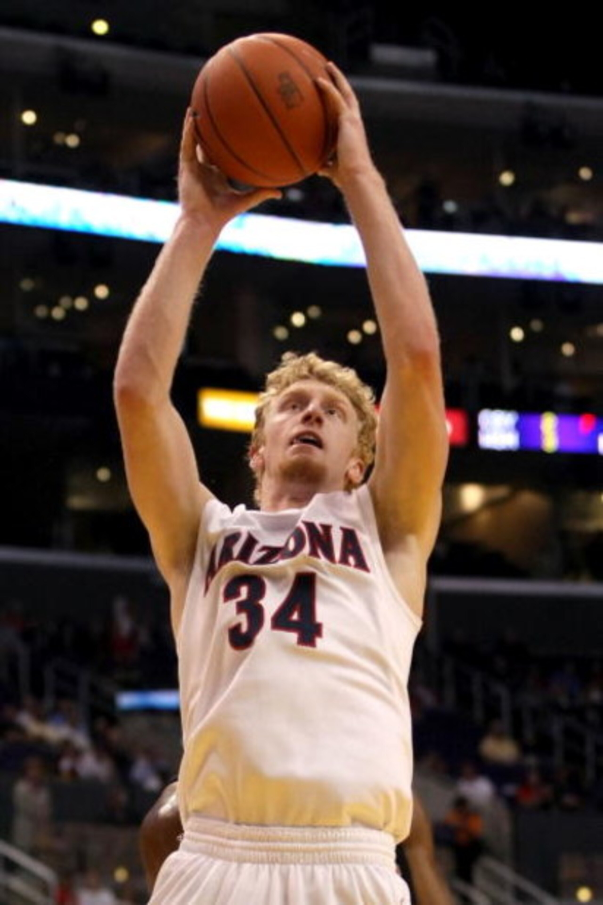 LOS ANGELES, CA - MARCH 12:  Chase Budinger #34 of the Arizona Wildcats shoots over the defense of the Oregon State Beavers during the 2008 Pacific Life Pac-10 Men's Basketball Tournament Day One at Staples Center on March 12, 2008 in Los Angeles, Califor