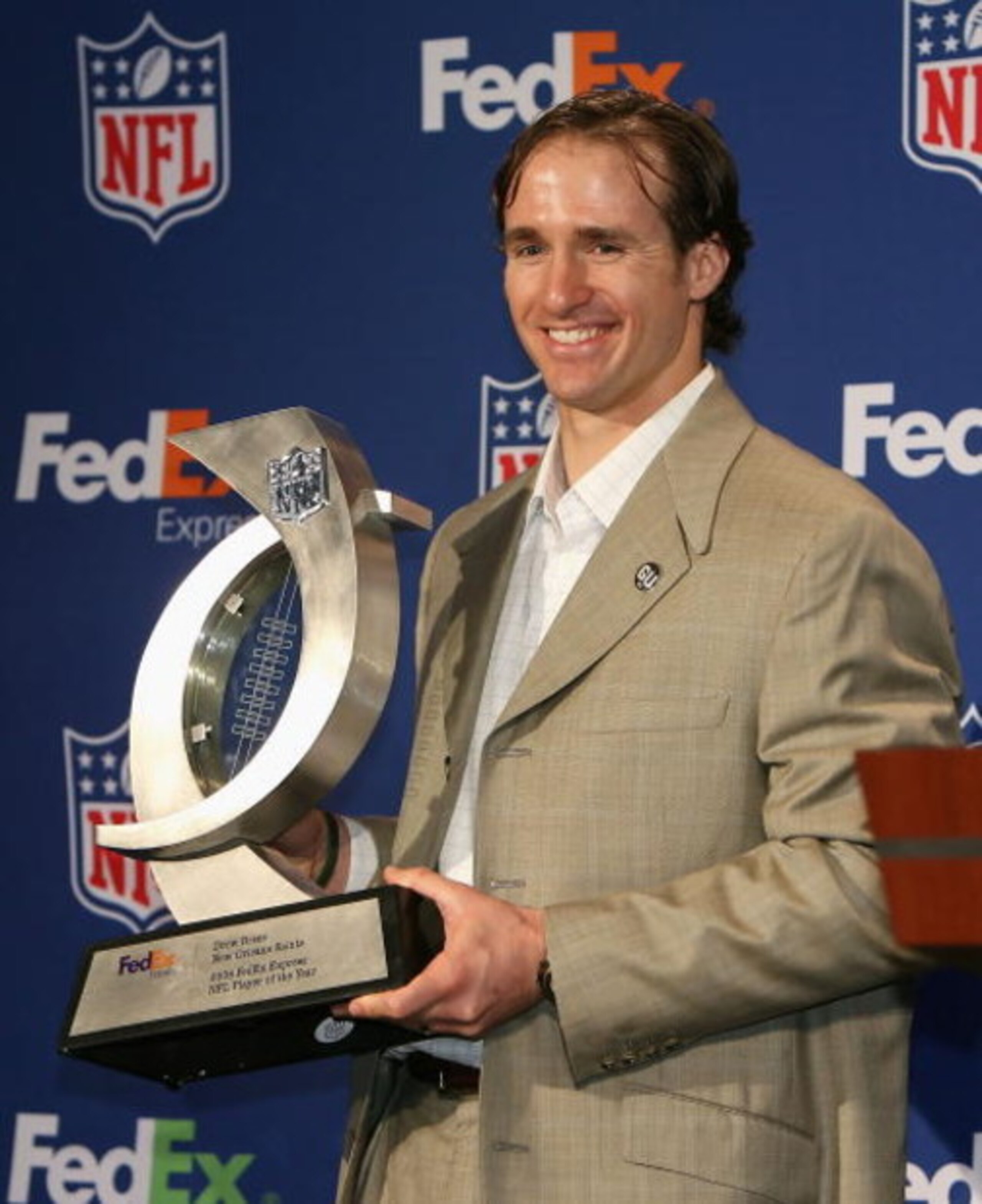 TAMPA, FL - JANUARY 28:  Quarterback Drew Brees of the New Orleans Saints poses with the 'FedEx Air Player of the Year' trophyl during the 'FedEx Air & Ground NFL Players of the Year' press conference at the Convention Center on January 28, 2009 in Tampa,