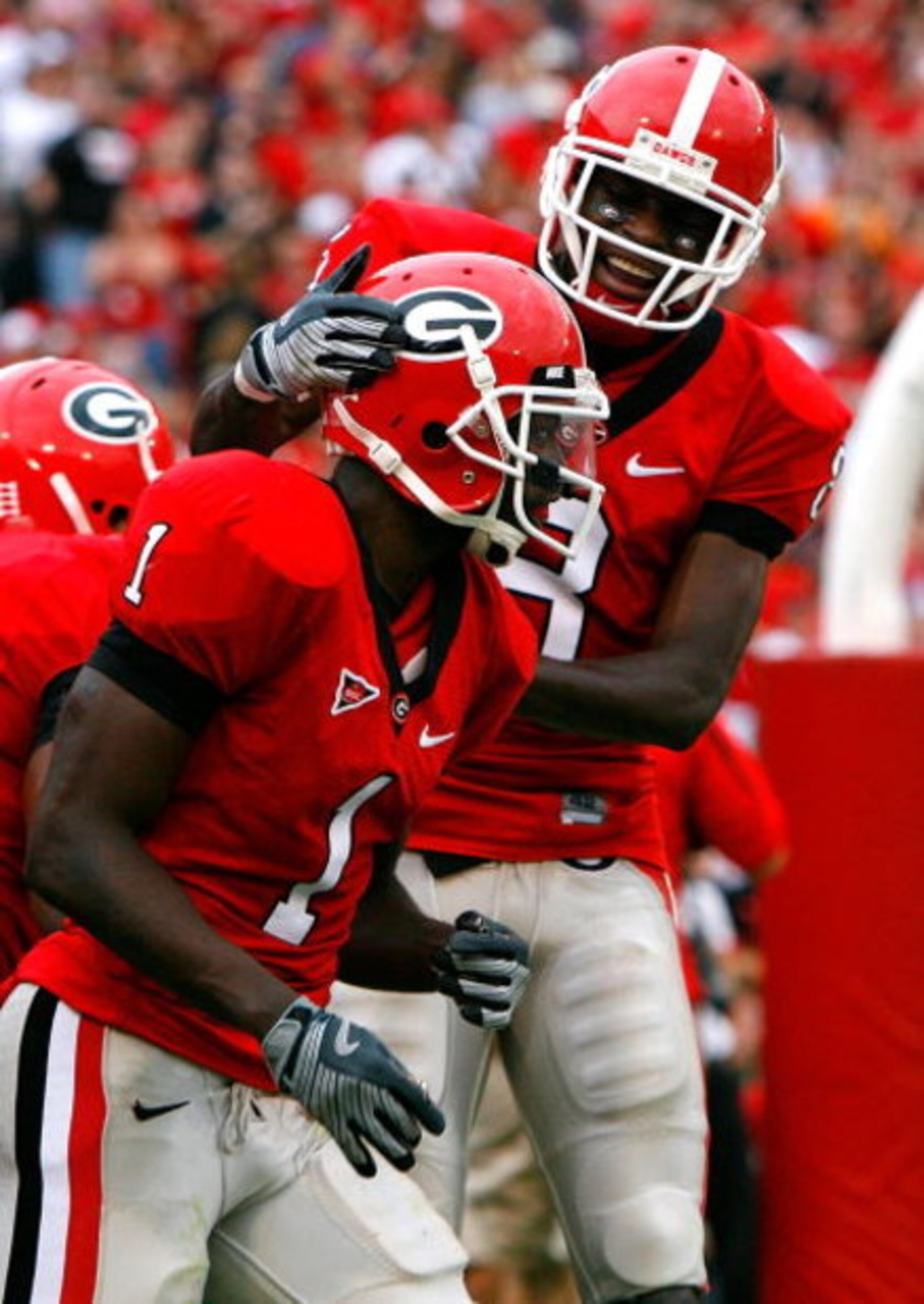 ATHENS, GA - OCTOBER 11:  A.J. Green #8 congratulates Mohamed Massaquoi #1 of the Georgia Bulldogs after Massaquoi's touchdown against the Tennessee Volunteers to end the first half at Sanford Stadium on October 11, 2008 in Athens, Georgia.  (Photo by Kev