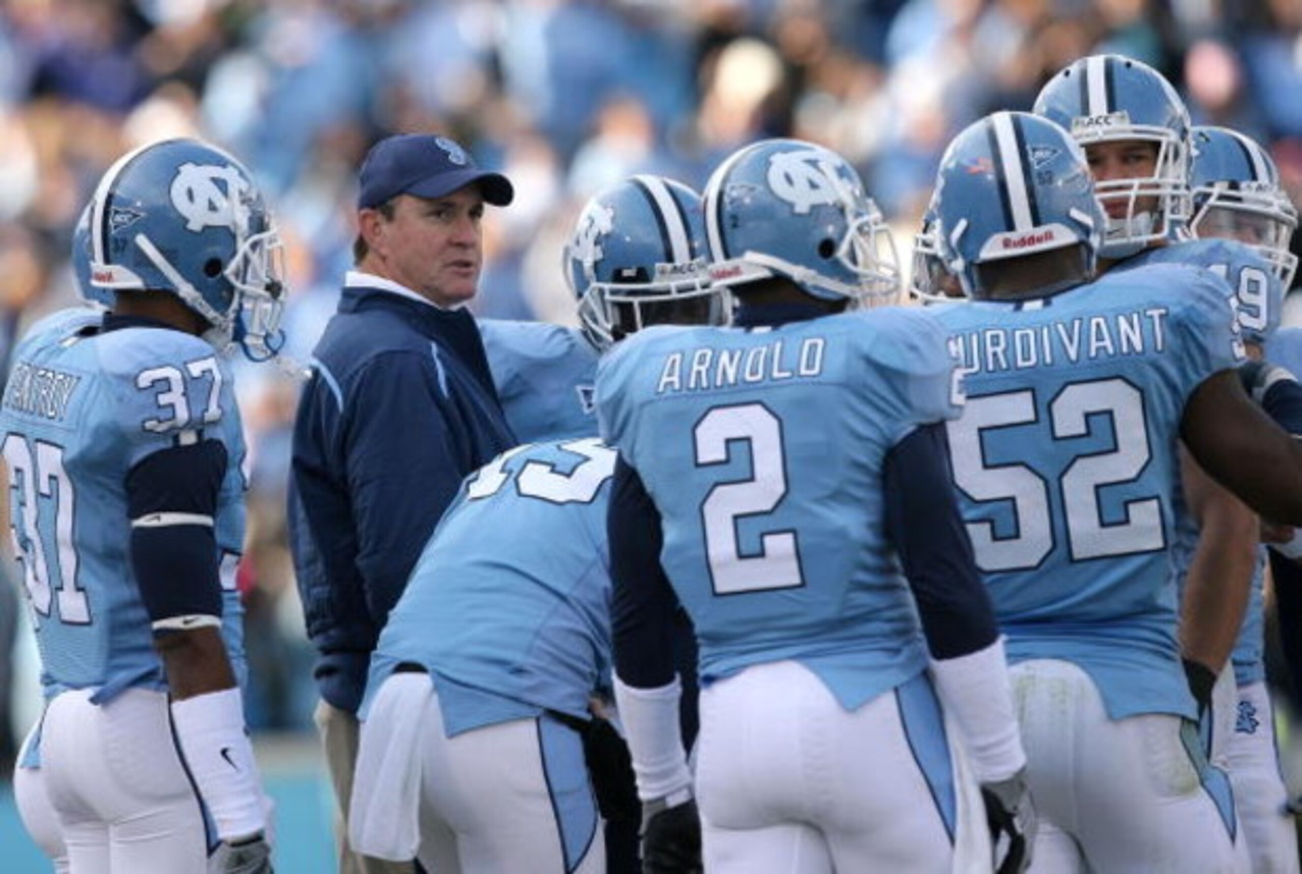 CHAPEL HILL, NC - NOVEMBER 22:  Head coach Butch Davis of the North Carolina Tar Heels talks to his players during their game against the North Carolina State Wolfpack at Kenan Stadium on November 22, 2008 in Chapel Hill, North Carolina.  (Photo by Street