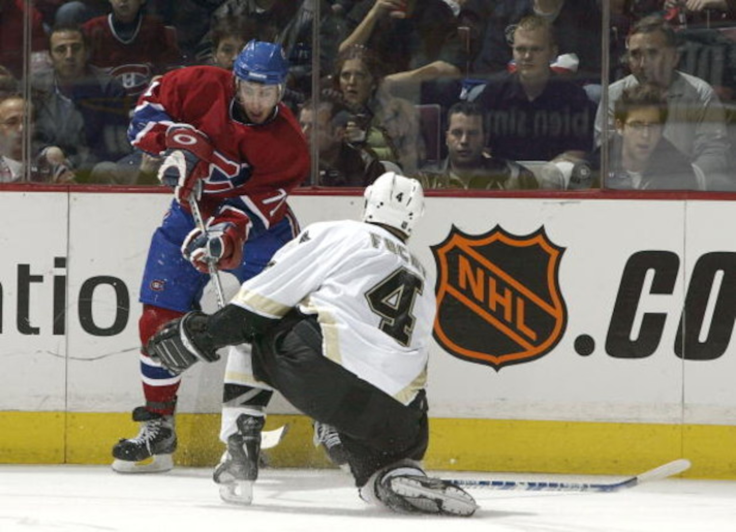 MONTREAL - DECEMBER 22:  Mike Ribeiro #71 of the Montreal Canadiens can't get around Dan Focht #4 of the Pittsburgh Penguins during the game on December 22, 2003 at Molson Centre in Montreal, Quebec, Canada.  (Photo by Harry How/Getty Images)