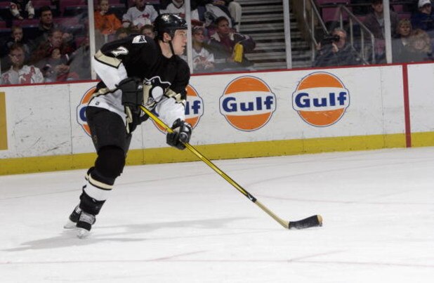 EAST RUTHERFORD, NJ - DECEMBER 6:  Defenseman Andrew Ference #7 of the Pittsburgh Penguins skates with the puck against the New Jersey Devils at Continental Airlines Arena on December 6, 2002 in East Rutherford, New Jersey. The Devils won 2-1. (Photo by E