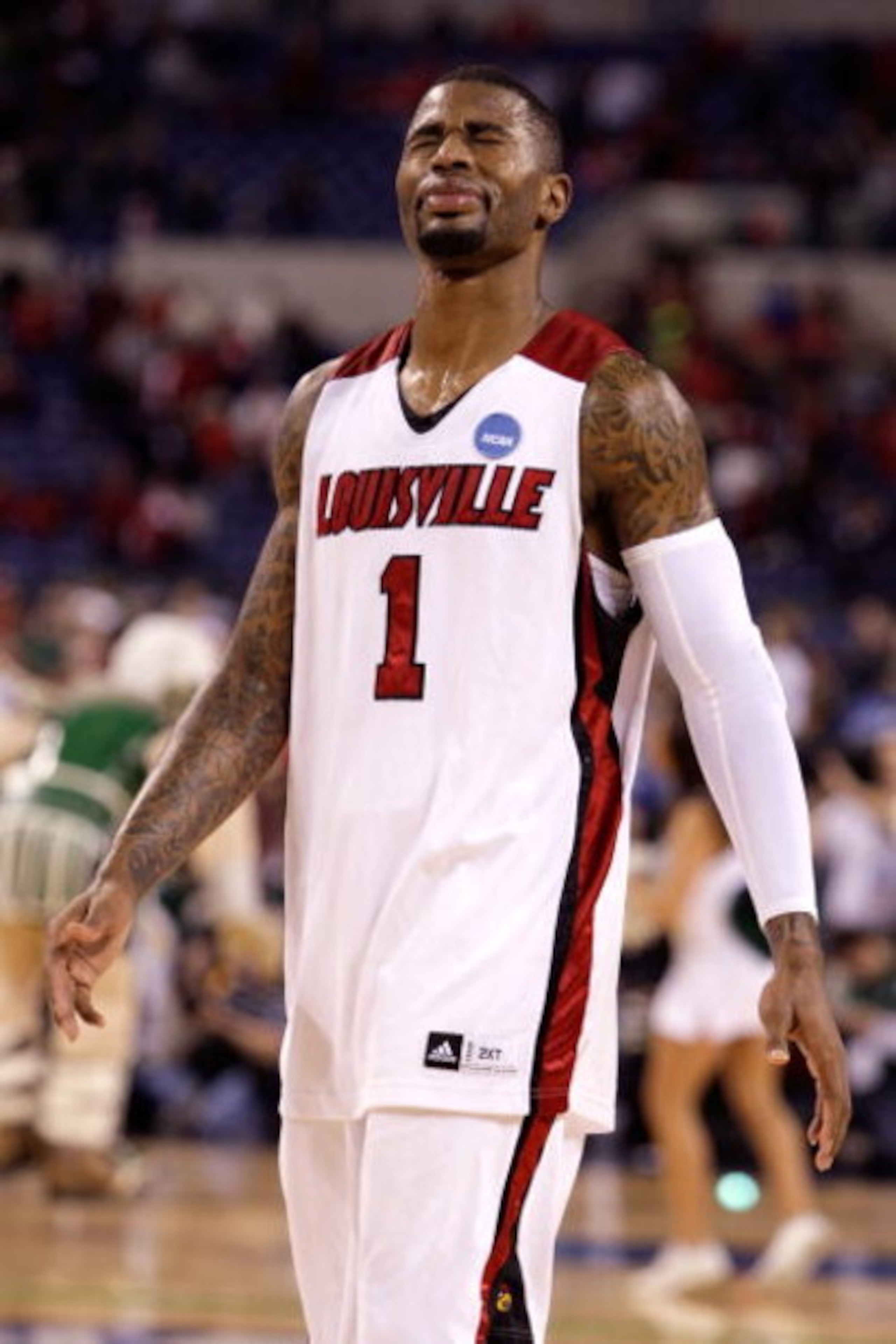 INDIANAPOLIS - MARCH 29:  Terrence Williams #1 of the Louisville Cardinals looks on dejected as he walks off the court following their 64-52 loss against the Michigan State Spartans during the fourth round of the NCAA Division I Men's Basketball Tournamen