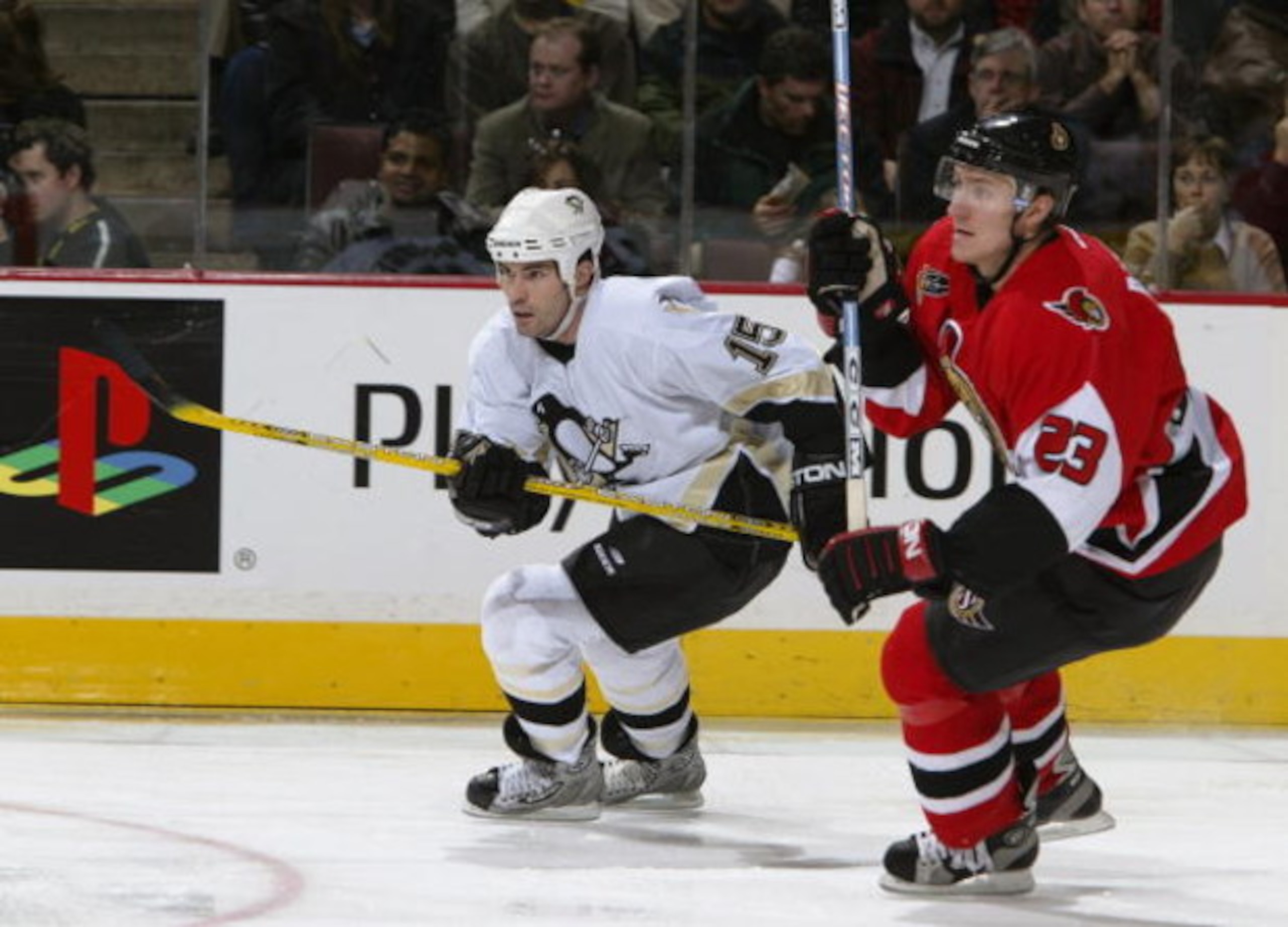 OTTAWA - JANUARY 22:  Center Brian Holzinger #15 of the Pittsburgh Penguins skates past defenseman Karel Rachunek #23 of the Ottawa Senators during the game at Corel Centre on January 22, 2004 in Ottawa, Ontario. The Senators defeated the Penguins 6-5. (P
