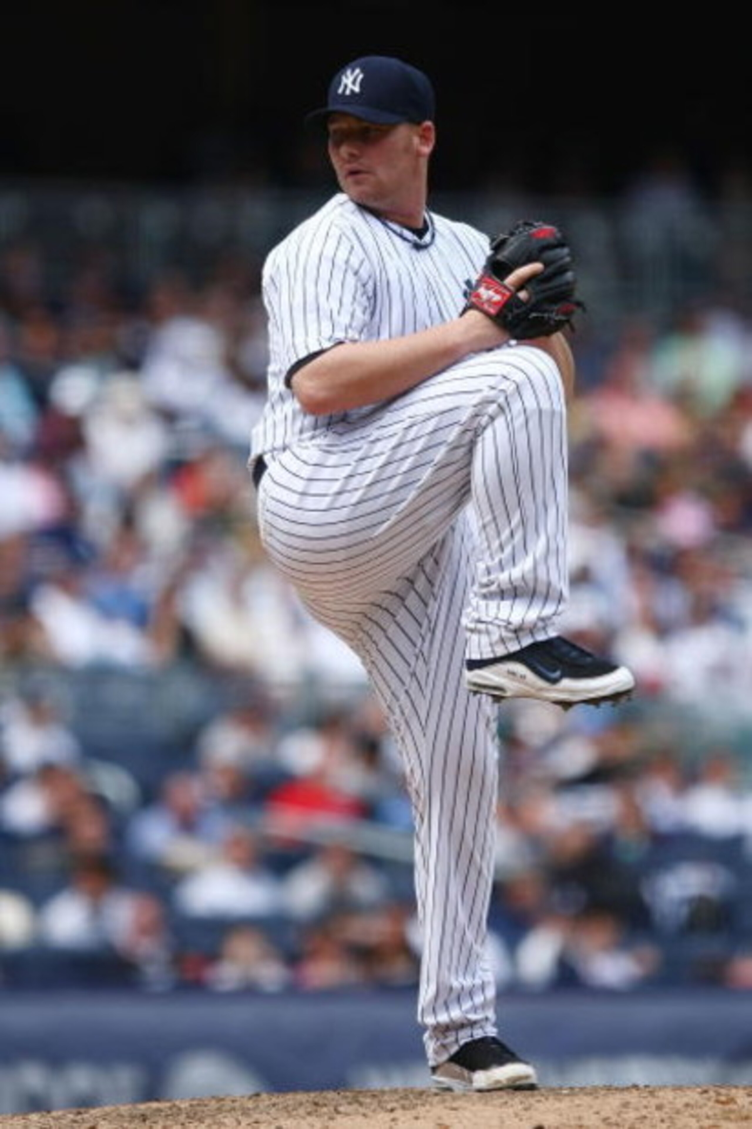 NEW YORK - JUNE 04: Phil Coke #48 of the New York Yankees pitches against the Texas Rangers during their game on June 4, 2009 at Yankee Stadium in the Bronx borough of New York City. (Photo by Chris McGrath/Getty Images) NEW YORK - JUNE 04: Phil Coke #48 of the New York Yankees pitches against the Texas Rangers during their game on June 4, 2009 at Yankee Stadium in the Bronx borough of New York City. (Photo by Chris McGrath/Getty Images)