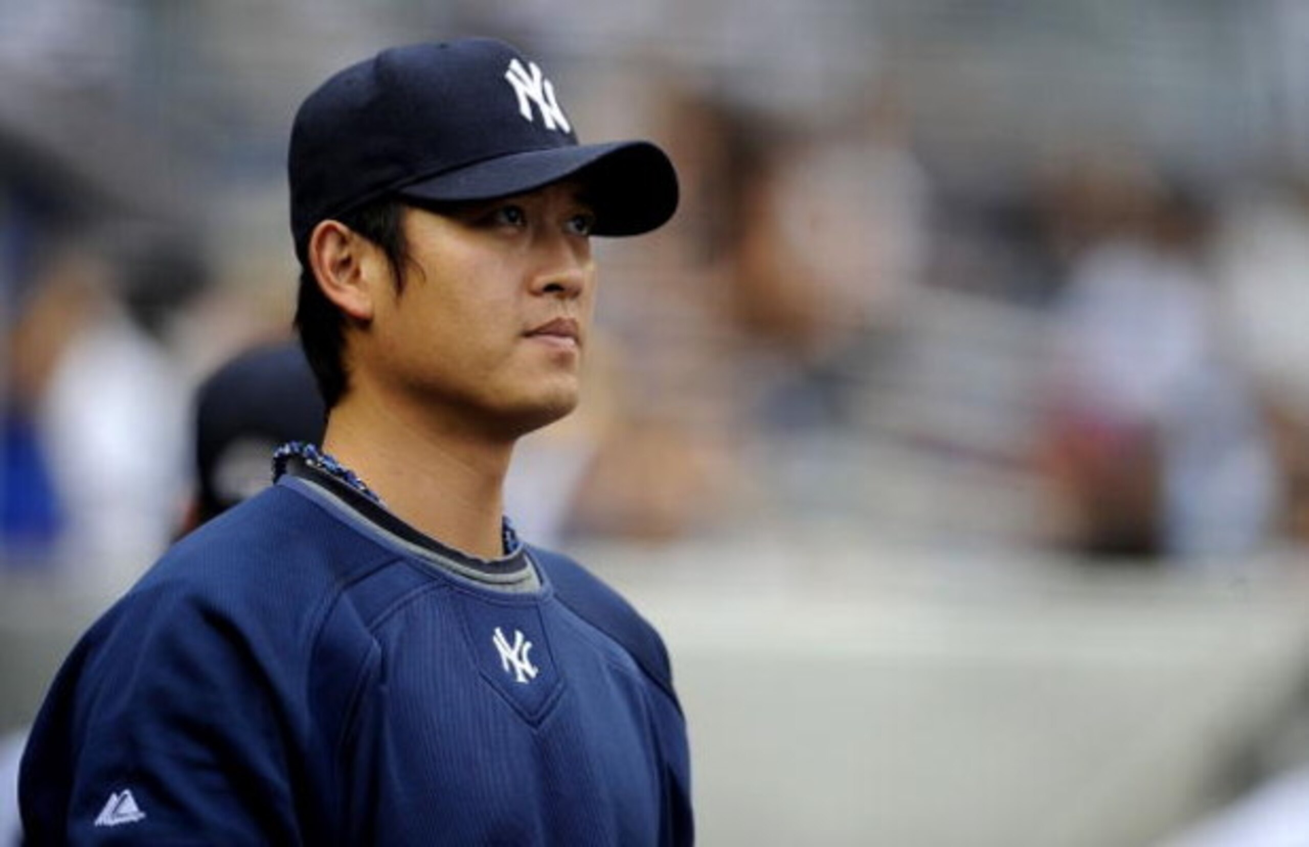 NEW YORK - JUNE 13: Chien-Ming Wang #40 of the New York Yankees stands in the dugout in a game against the New York Mets on June 13, 2009 at Yankee Stadium in the Bronx Borough of New York City. (Photo by Jeff Zelevansky/Getty Images) NEW YORK - JUNE 13: Chien-Ming Wang #40 of the New York Yankees stands in the dugout in a game against the New York Mets on June 13, 2009 at Yankee Stadium in the Bronx Borough of New York City. (Photo by Jeff Zelevansky/Getty Images)