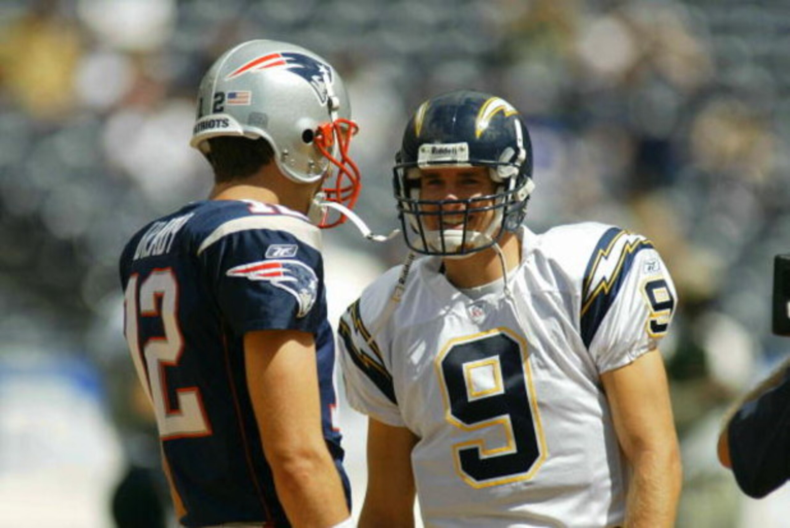 SAN DIEGO - SEPTEMBER 29:  Tom Brady #12  of the New England Patriots and Drew Brees #9 of the San Diego Chargers have a few words before a game on September 29, 2002 at Qualcomm Stadium in San Diego, California. (Photo by Doug Benc/Getty Images)