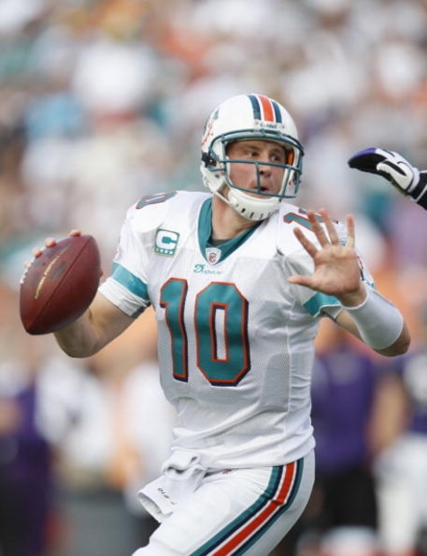 MIAMI - JANUARY 4:  Chad Pennington #10 of the Miami Dolphins scrambles during a AFC Wild Card playoff game against the Baltimore Ravens on January 4, 2009 at Dolphin Stadium in Miami, Florida. (Photo by Gregory Shamus/Getty Images)