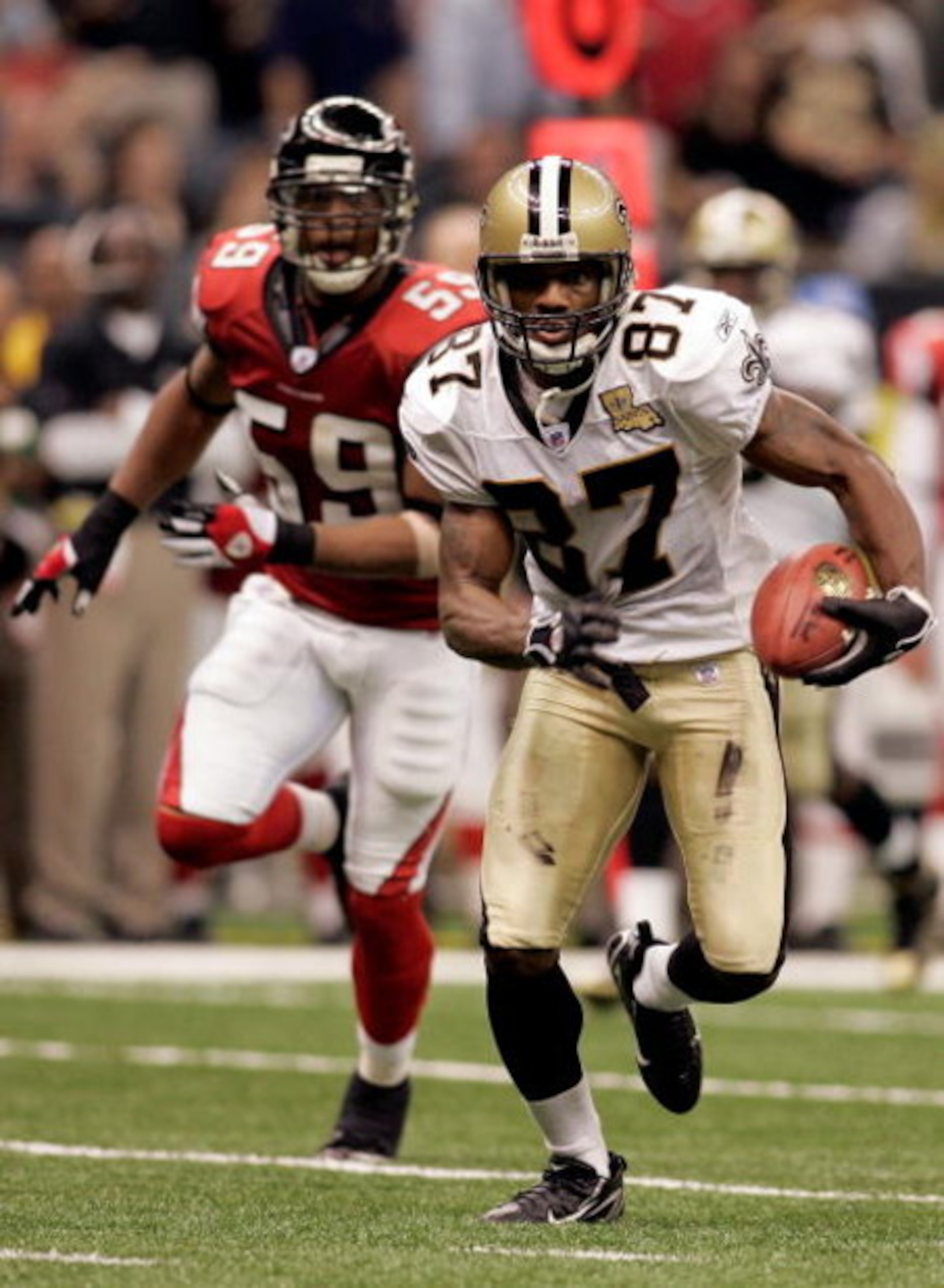 NEW ORLEANS - SEPTEMBER 25:  Wide Receiver Joe Horn #87 of the New Orleans Saints runs away from Michael Boley #59 of the Atlanta Falcons during the third quarter of the Monday Night Football game on September 25, 2006 at the Superdome in New Orleans, Lou