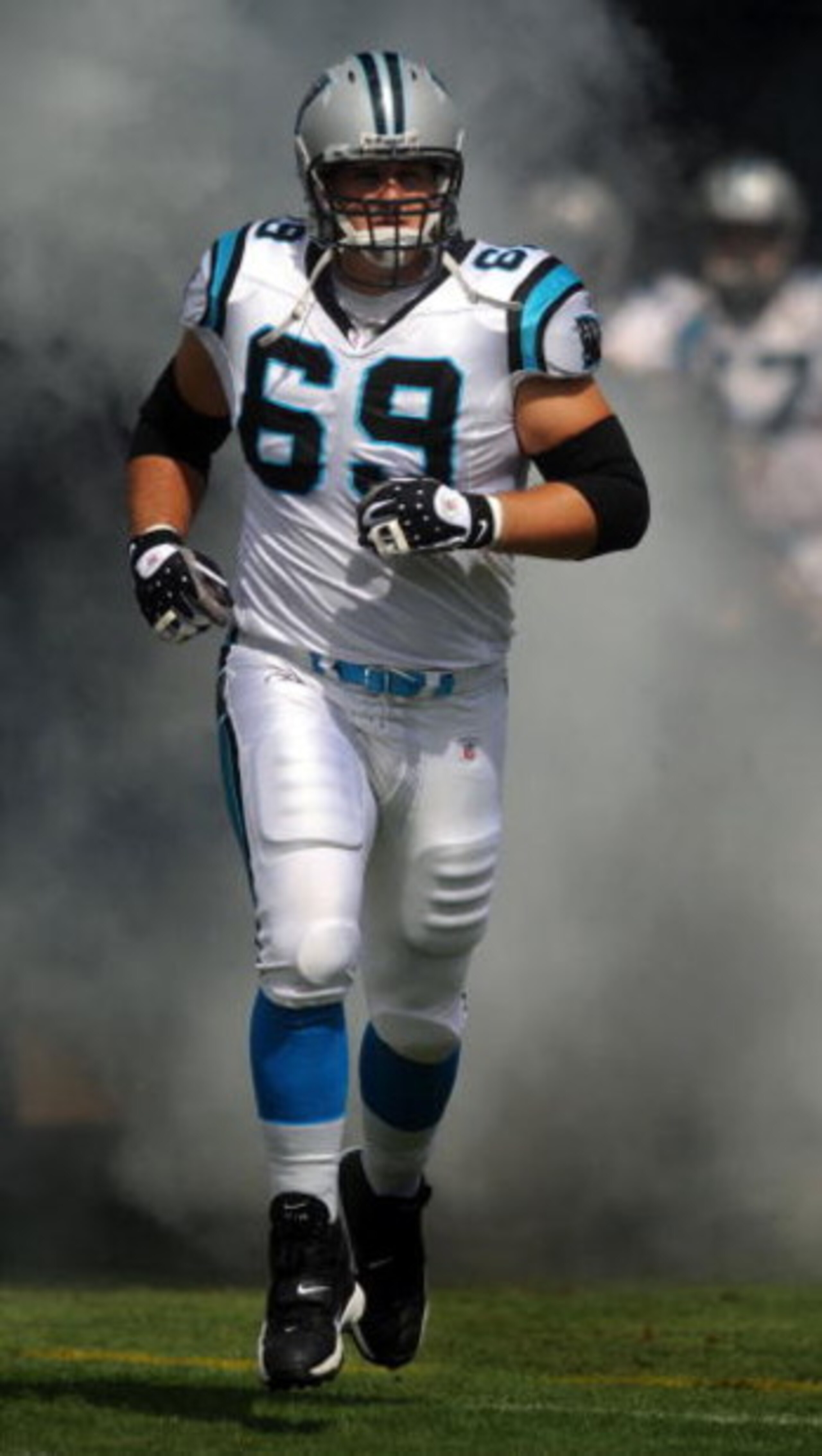 CHARLOTTE, NC - SEPTEMBER 28:  Offensive left tackle Jordan Gross #69 of the Carolina Panthers runs out of the tunnel during introductions before the game against the Atlanta Falcons at Bank of America Stadium on September 28, 2008 in Charlotte, North Car